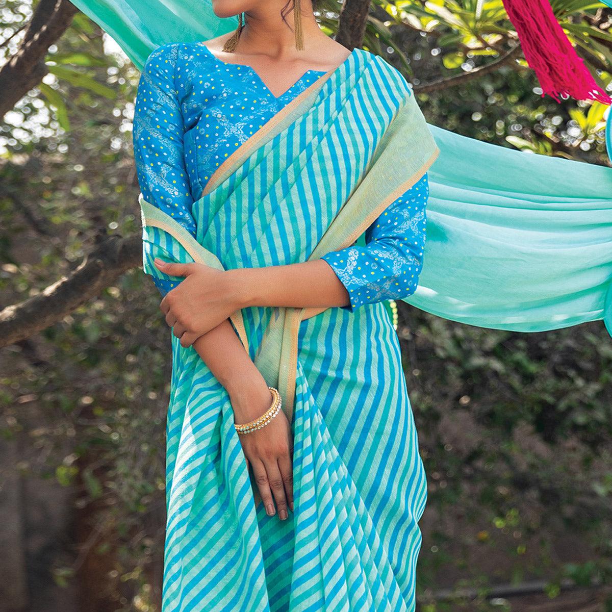 Sky Blue Striped Printed Cotton Saree With Tassels - Peachmode