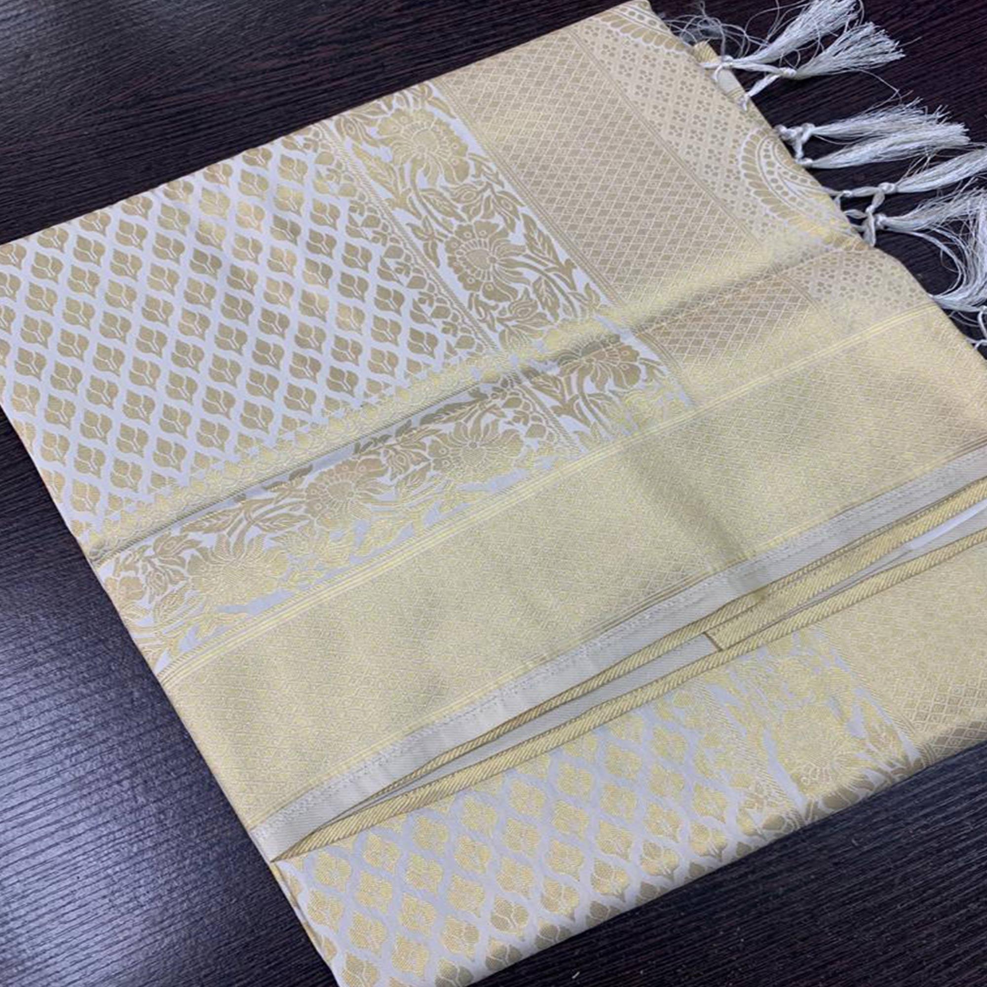 Staring Cream Colored Festive Wear Woven Silk Saree With Tassels - Peachmode
