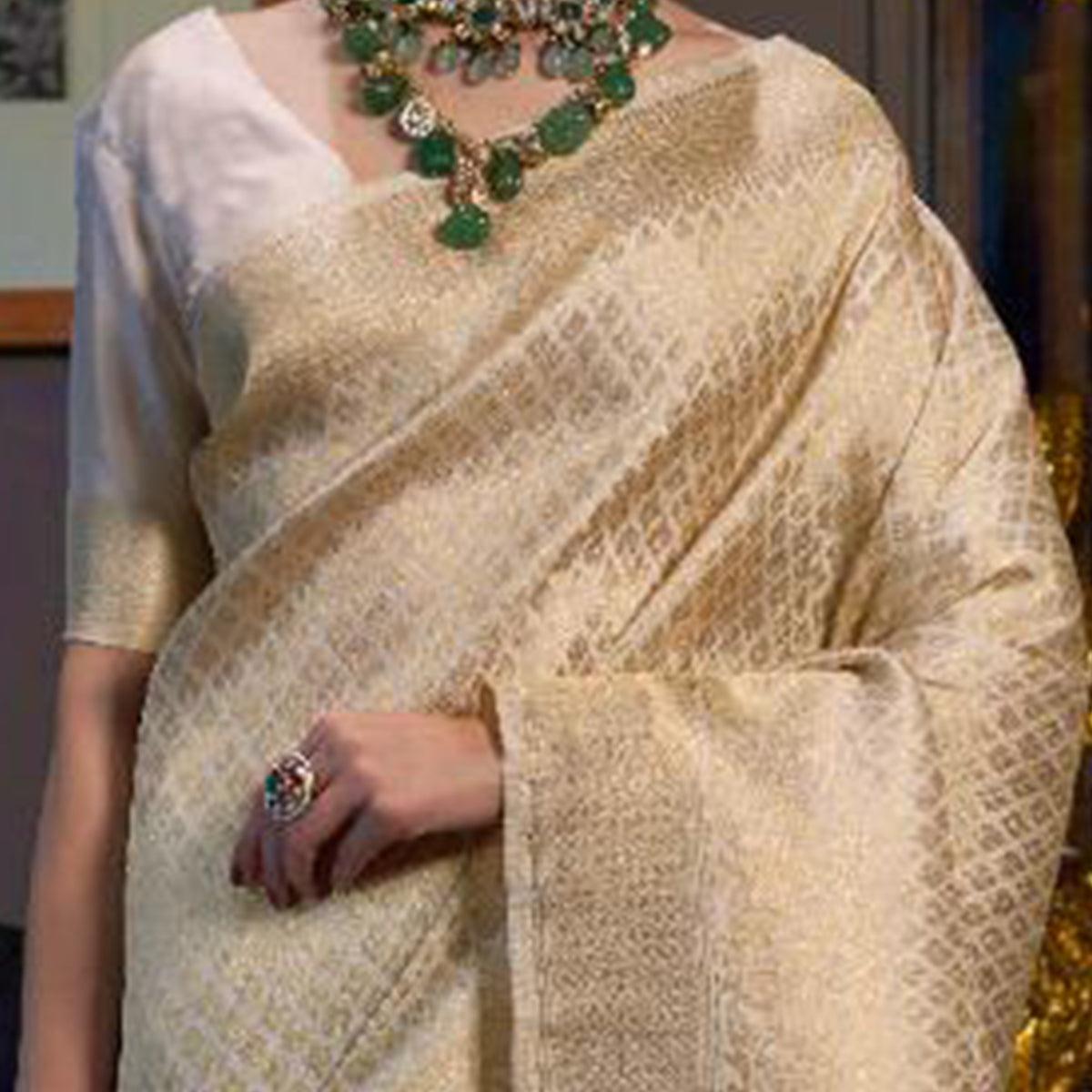 Staring Cream Colored Festive Wear Woven Silk Saree With Tassels - Peachmode
