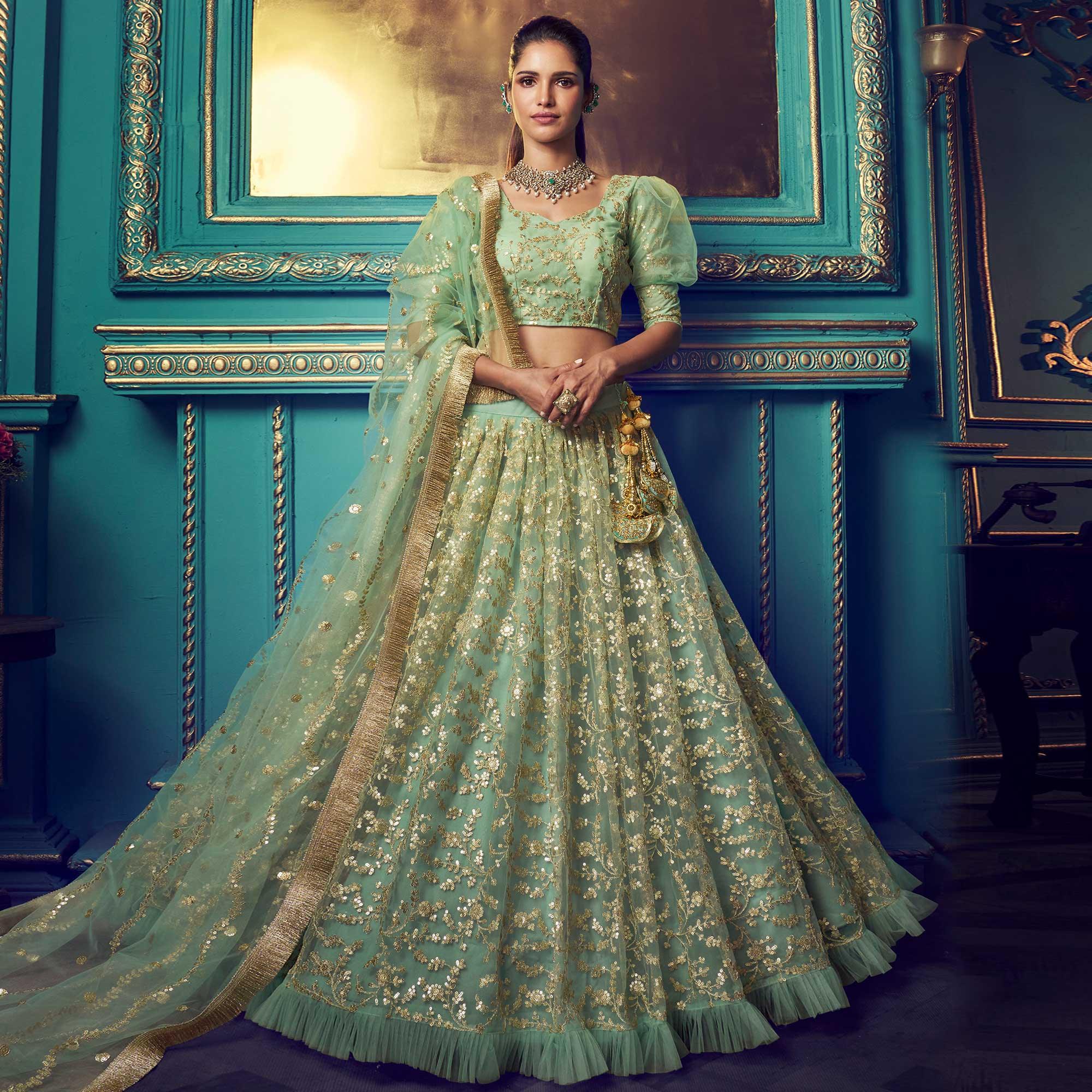 Staring Green Colored Partywear Embroidered Soft Net Lehenga Choli - Peachmode