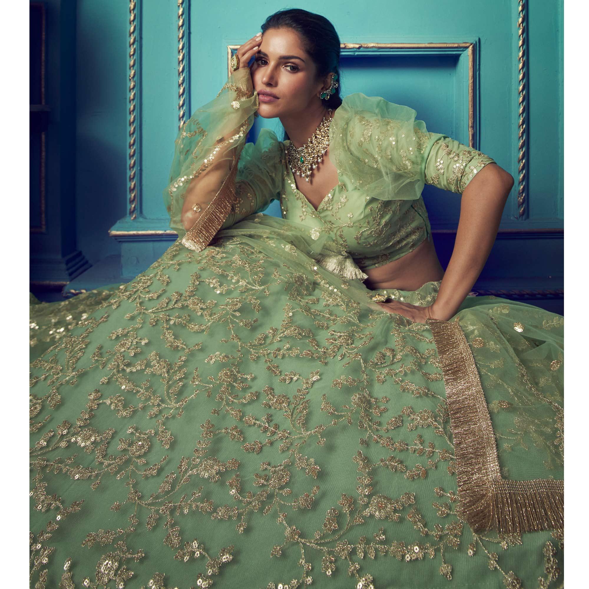 Staring Green Colored Partywear Embroidered Soft Net Lehenga Choli - Peachmode