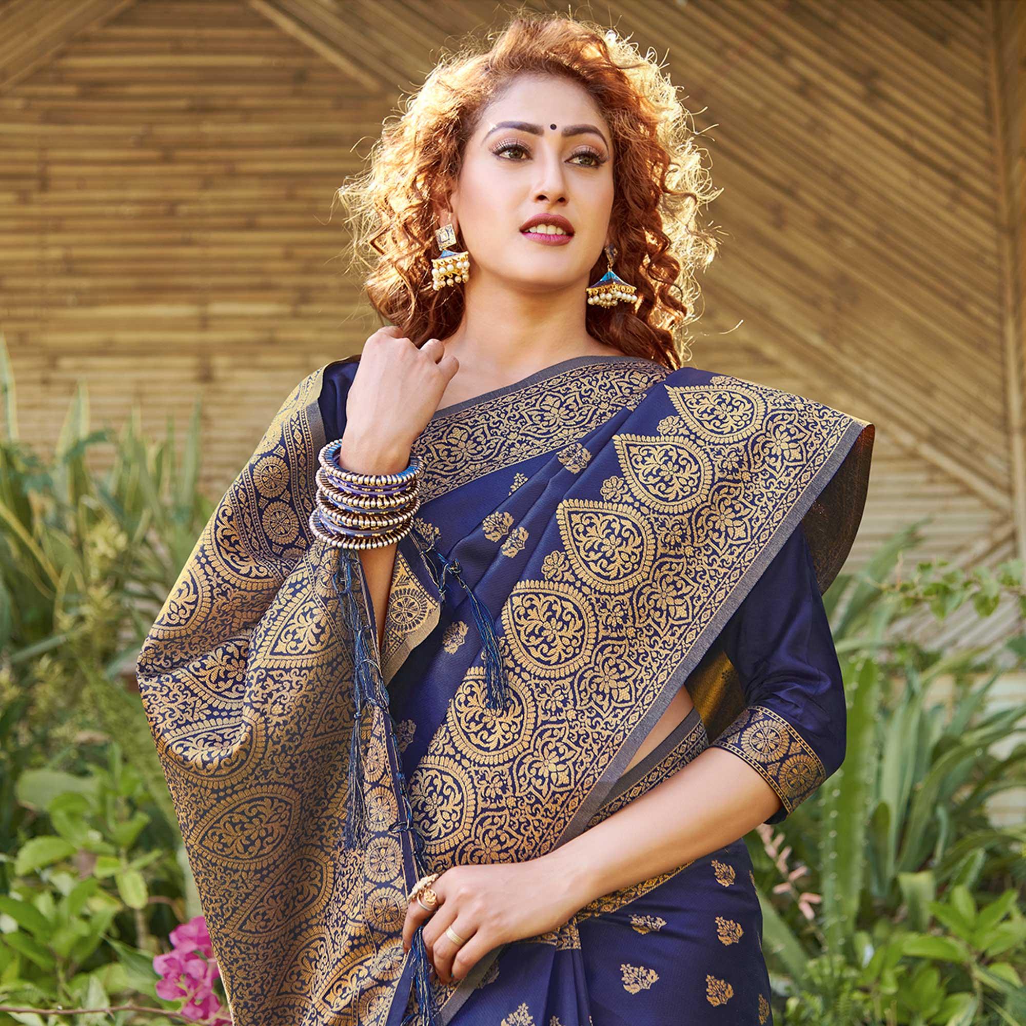 Staring Navy Blue Colored Festive Wear Geomatric Woven Silk Blend Saree With Tassels - Peachmode
