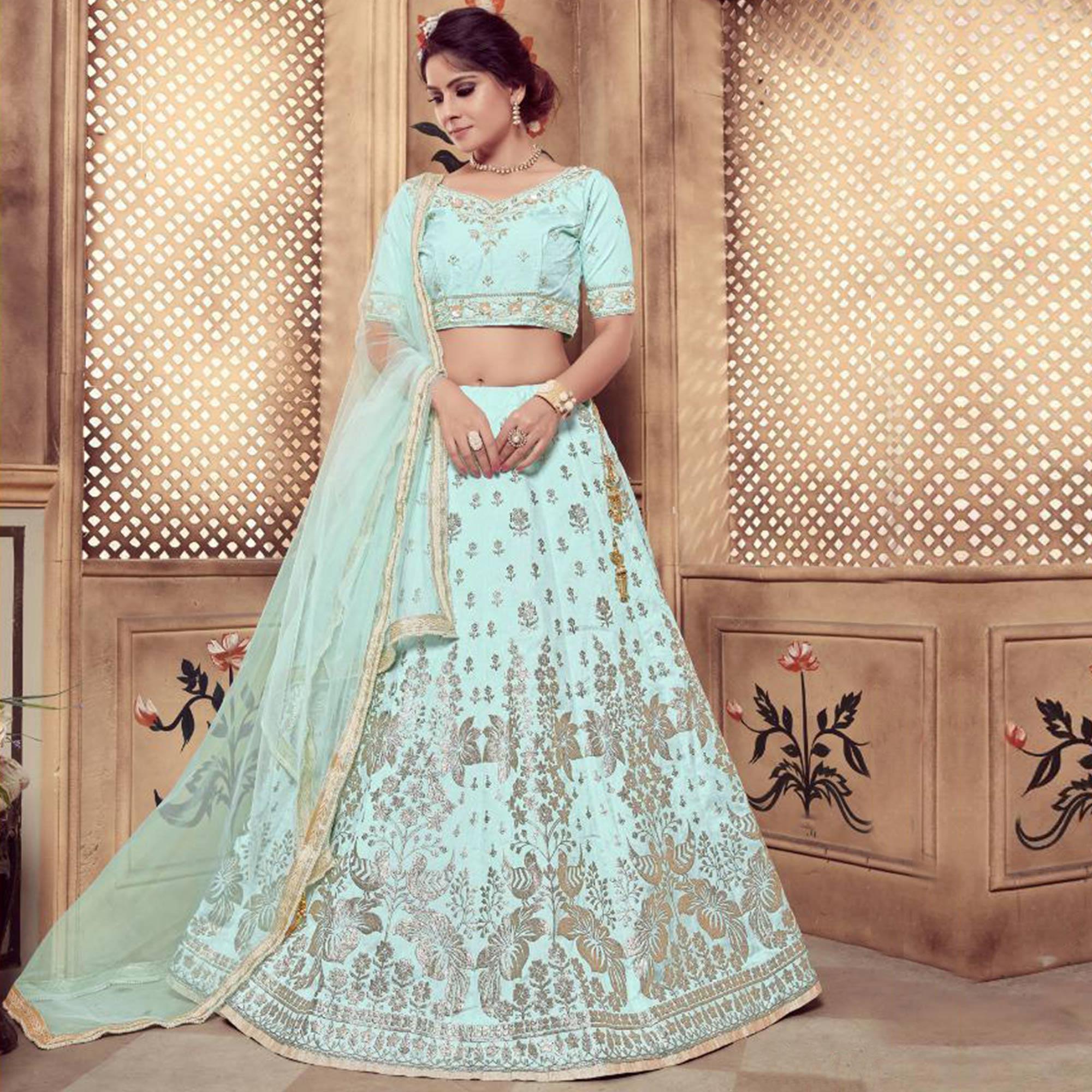 Staring Turquoise Blue Colored Party Wear Embroidered Silk Lehenga Choli - Peachmode