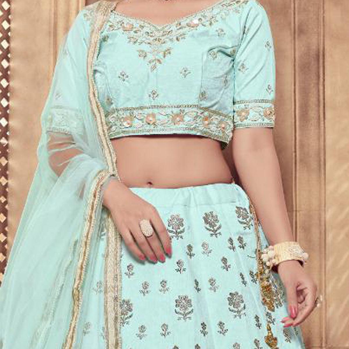 Staring Turquoise Blue Colored Party Wear Embroidered Silk Lehenga Choli - Peachmode