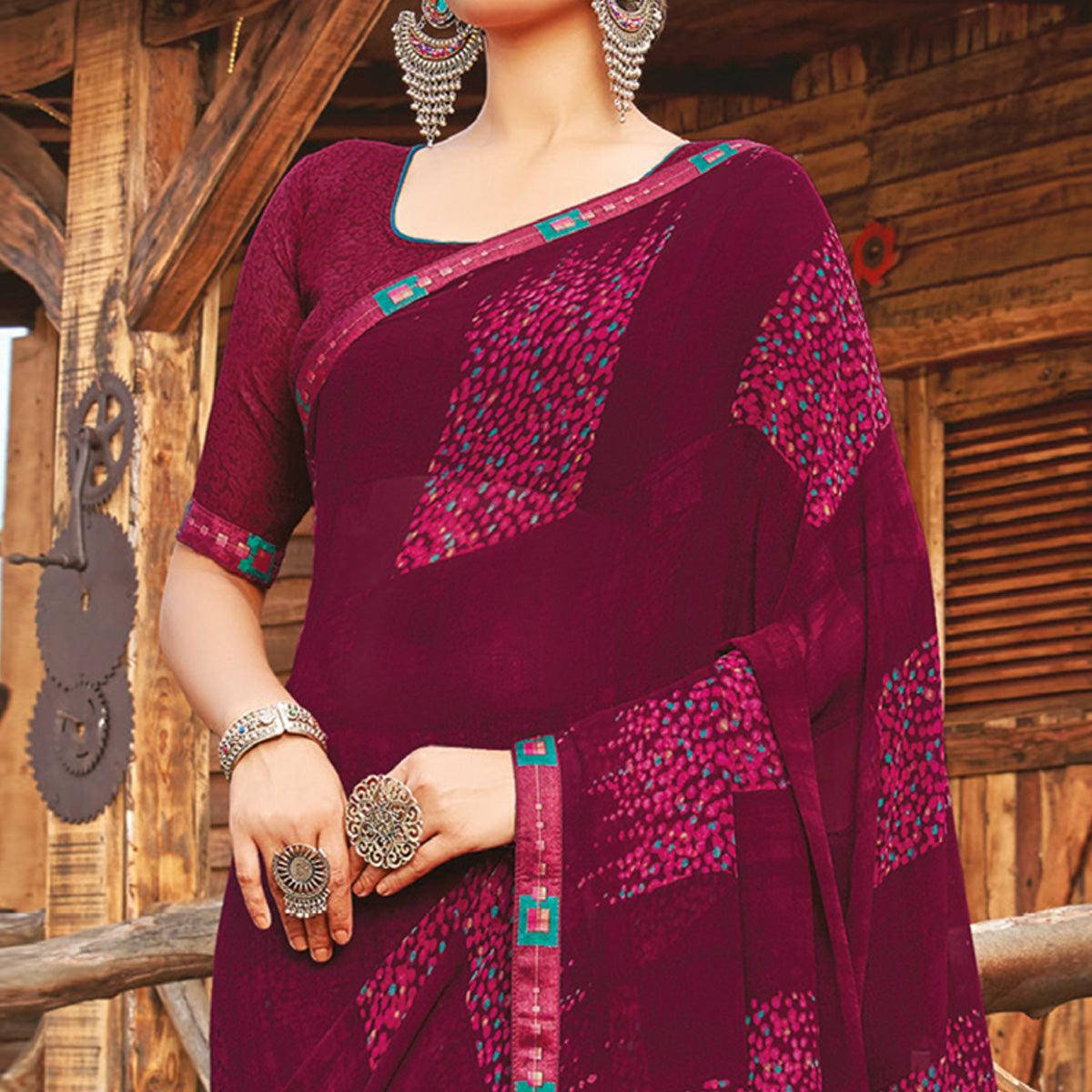 Staring Wine Coloured Partywear Pure Georgette Floral Printed Saree With Fancy Lace Border - Peachmode