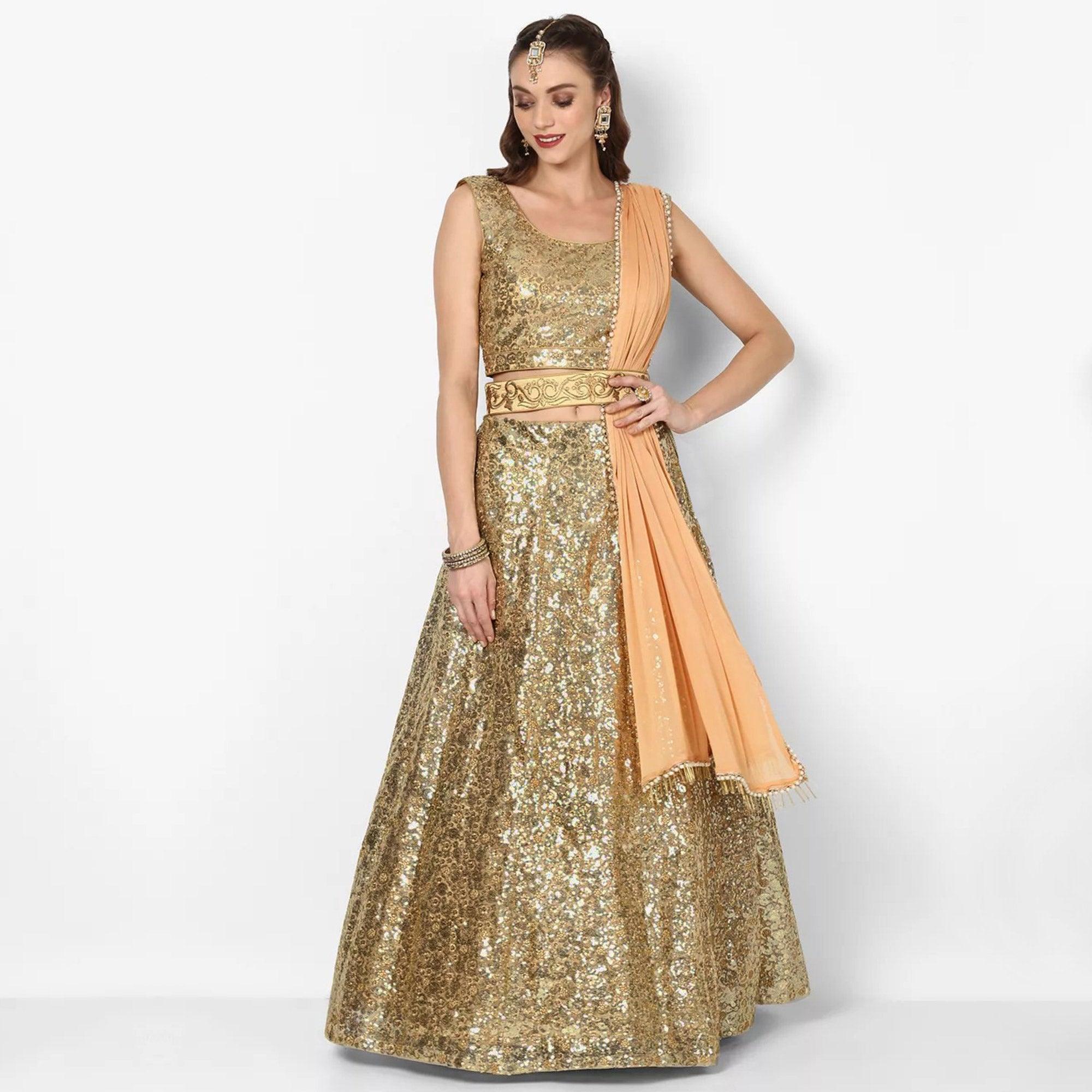 Stunning Golden Colored Partywear Embroidered Netted Lehenga Choli - Peachmode