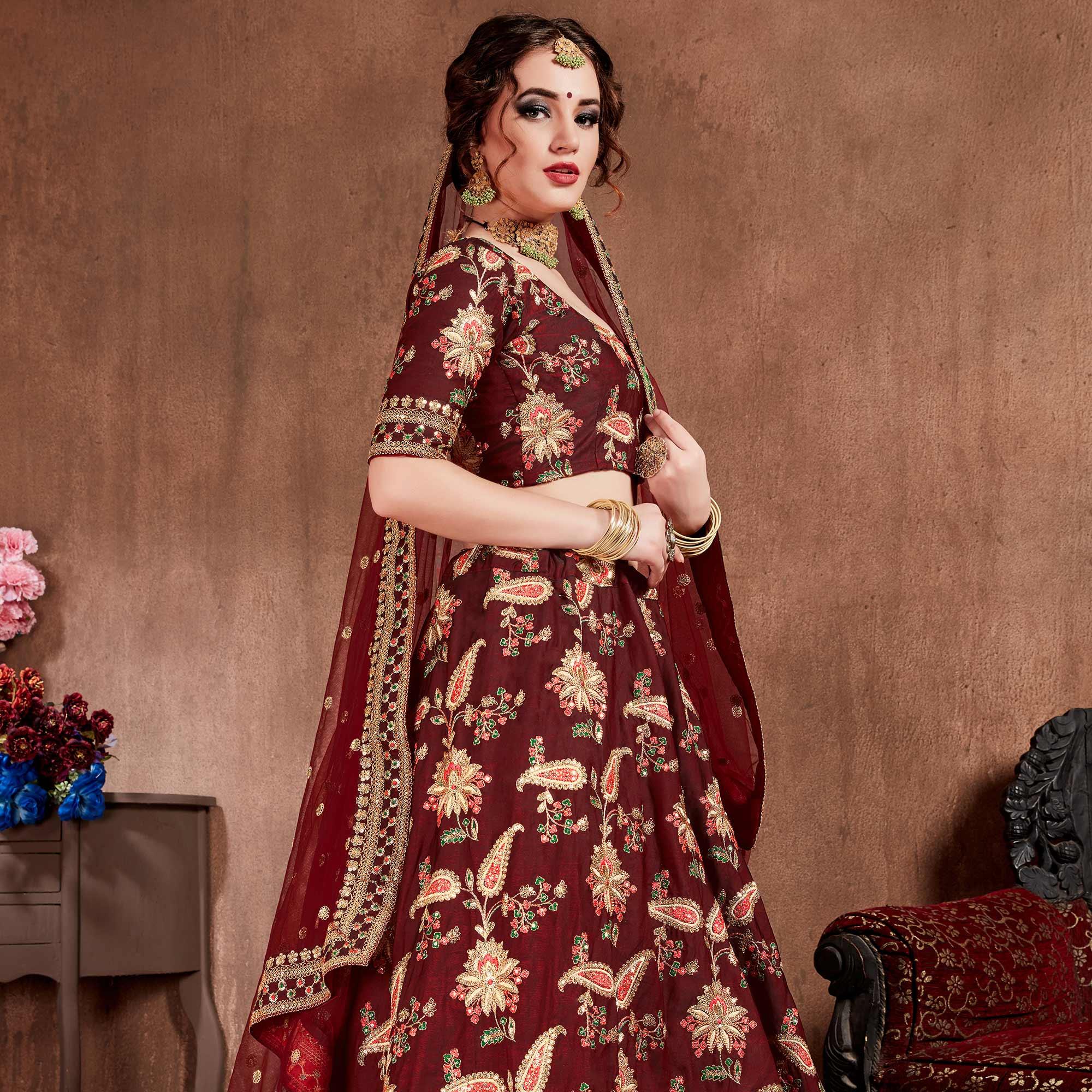 Stunning Maroon Colored Partywear Embroidered Tapeta Silk Lehenga Choli - Peachmode