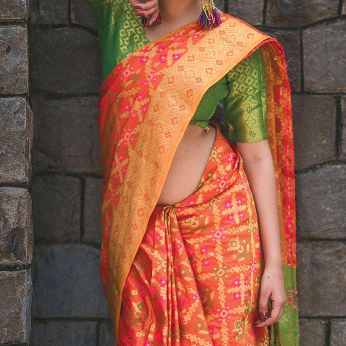 Stunning Orange Colored Festive Wear Designer Woven Patola Silk Saree - Peachmode