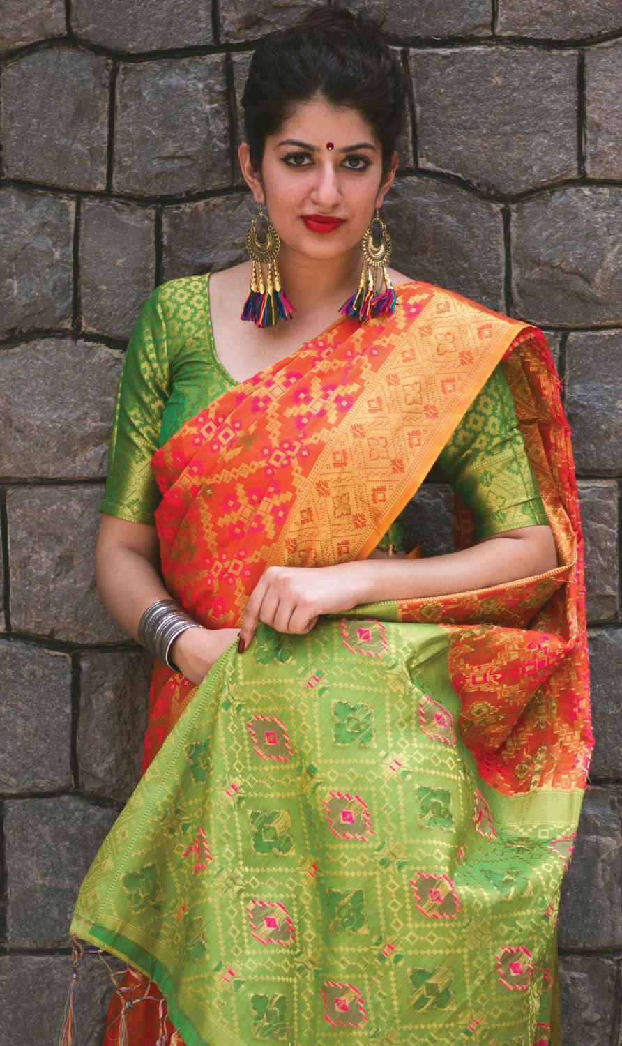 Stunning Orange Colored Festive Wear Designer Woven Patola Silk Saree - Peachmode