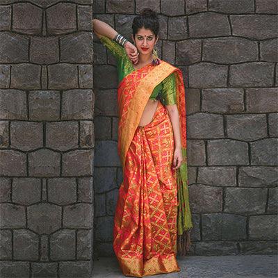 Stunning Orange Colored Festive Wear Designer Woven Patola Silk Saree - Peachmode