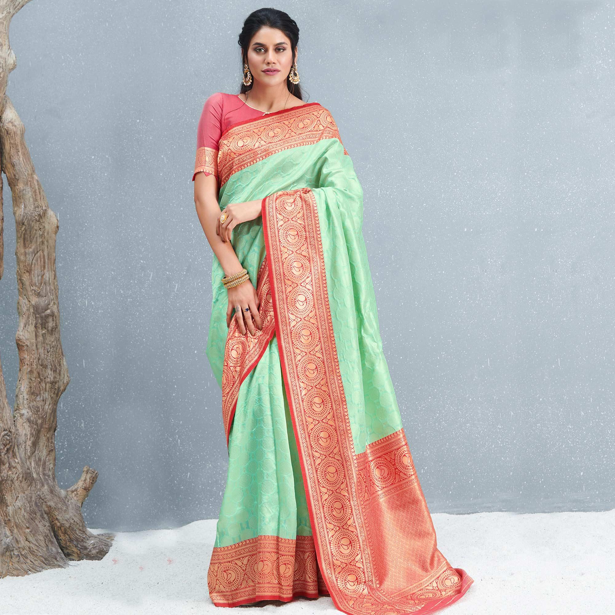 Stunning Pista Green Colored Festive Wear Woven Silk Saree - Peachmode