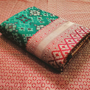 Stunning Rama Green Colored Festive Wear Woven Patola Silk Saree - Peachmode
