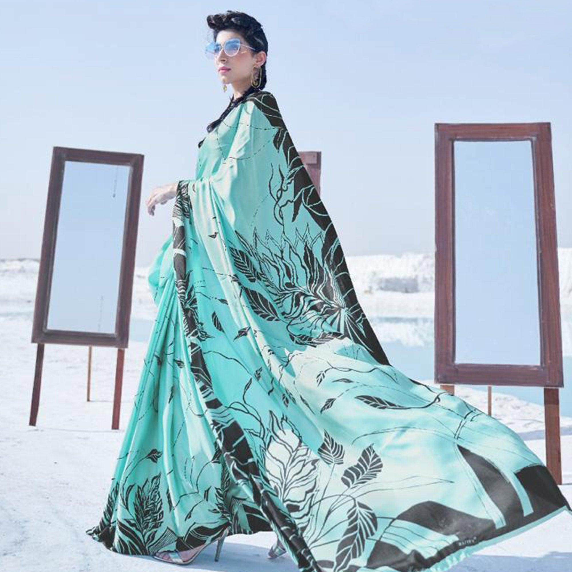 Surpassing Aqua Blue Colored Casual Wear Printed Satin Crepe Saree - Peachmode