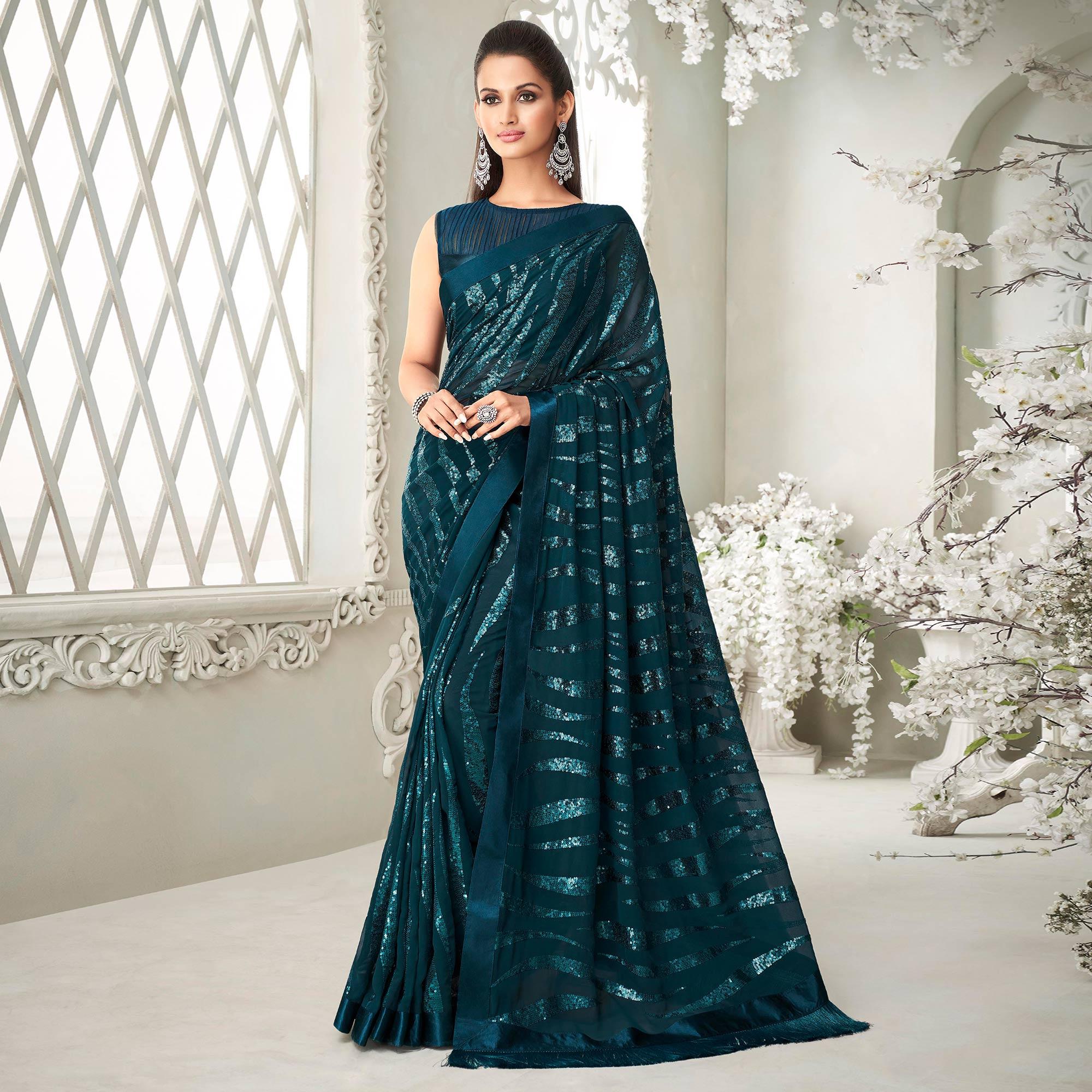 Teal Green Sequence Embroidered Georgette Saree With Tassels - Peachmode