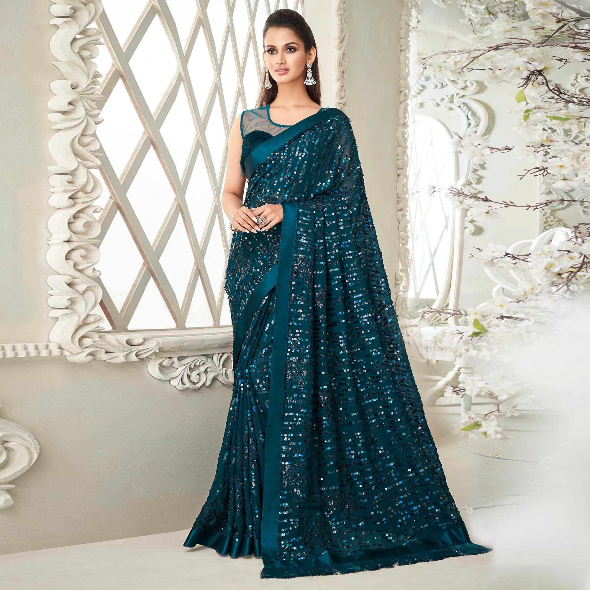 Teal Green Sequence Embroidered Georgette Saree With Tassels - Peachmode