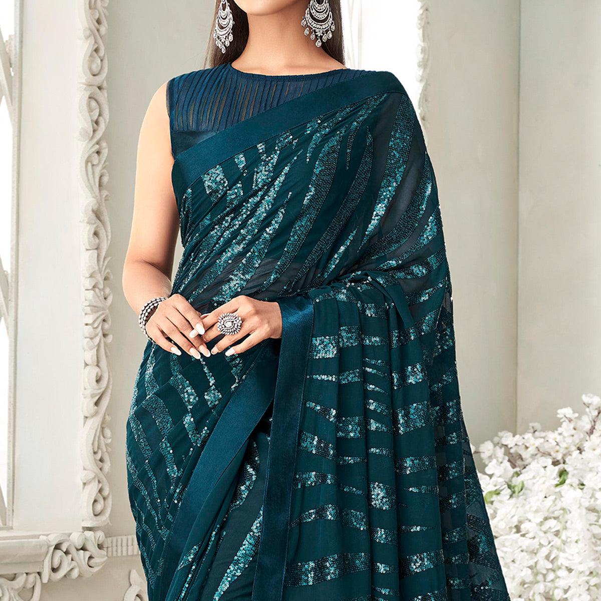 Teal Green Sequence Embroidered Georgette Saree With Tassels - Peachmode