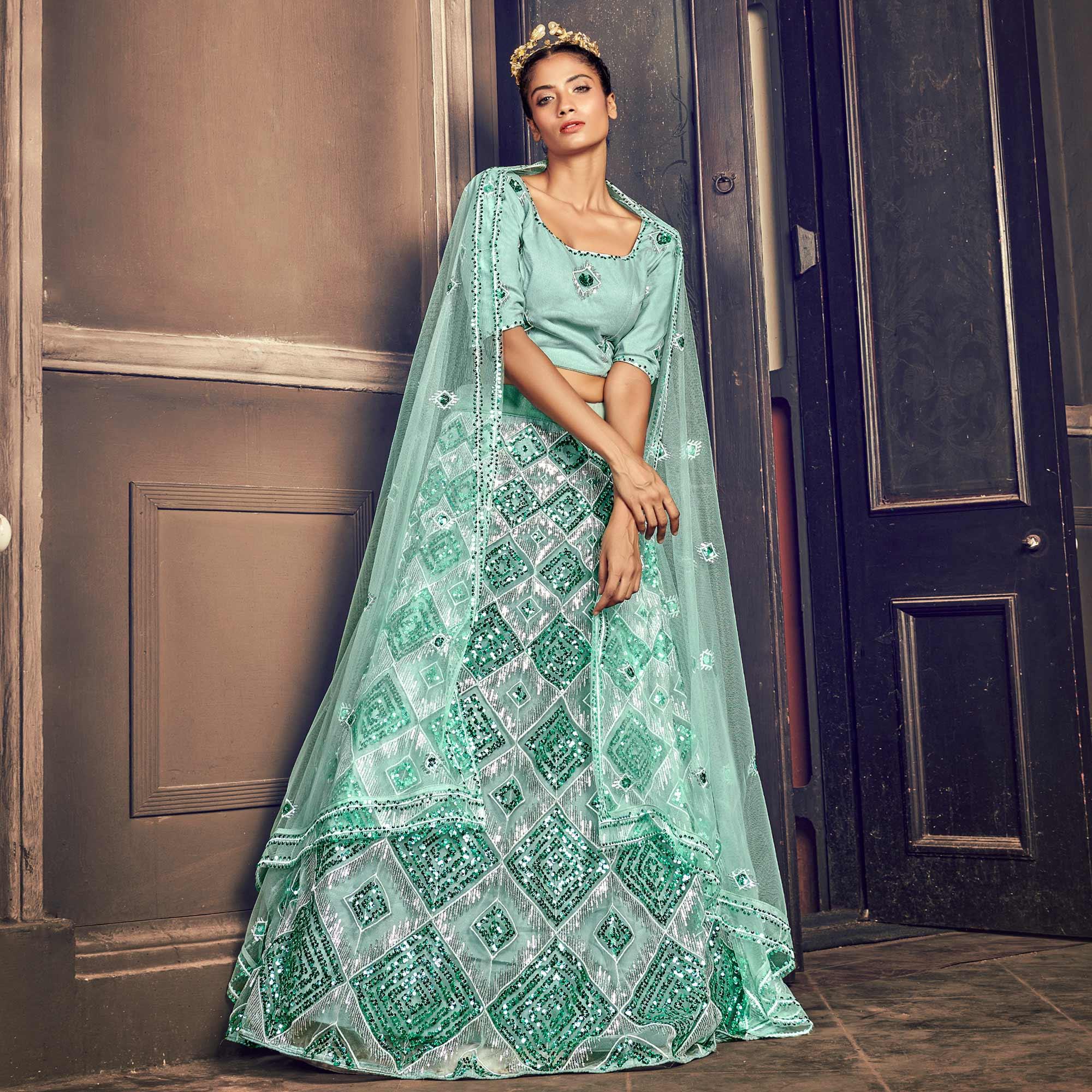 Turquoise Blue Partywear Sequence Embroidered Net Lehenga Choli - Peachmode