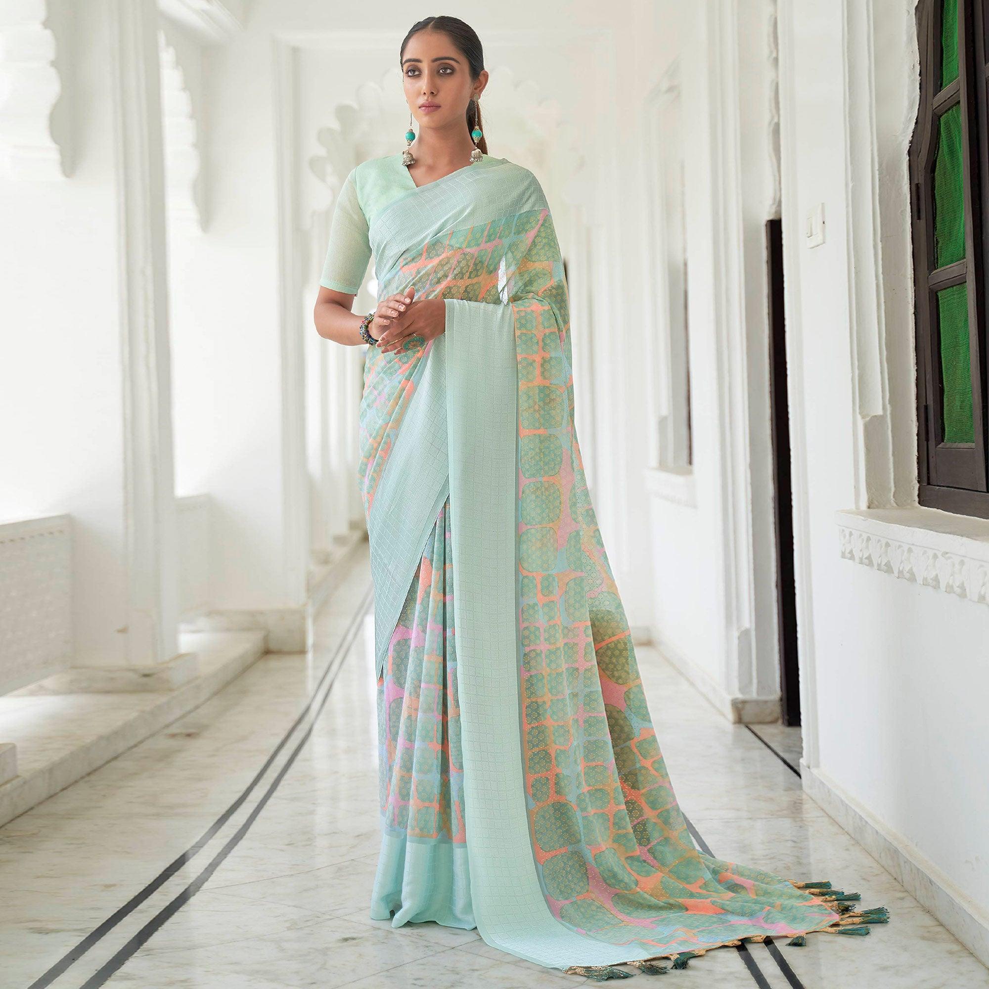 Turquoise Casual Wear Foil Printed Georgette Saree With Jacquard Border - Peachmode