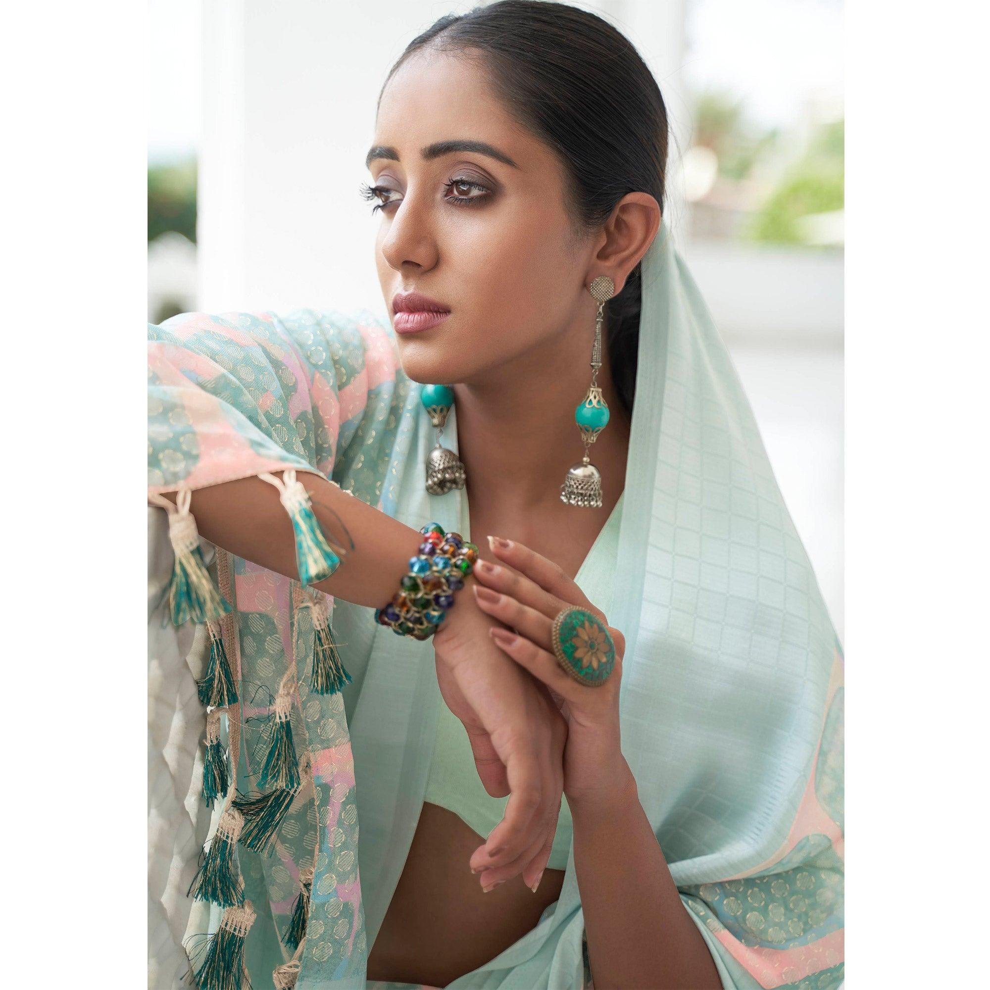 Turquoise Casual Wear Foil Printed Georgette Saree With Jacquard Border - Peachmode
