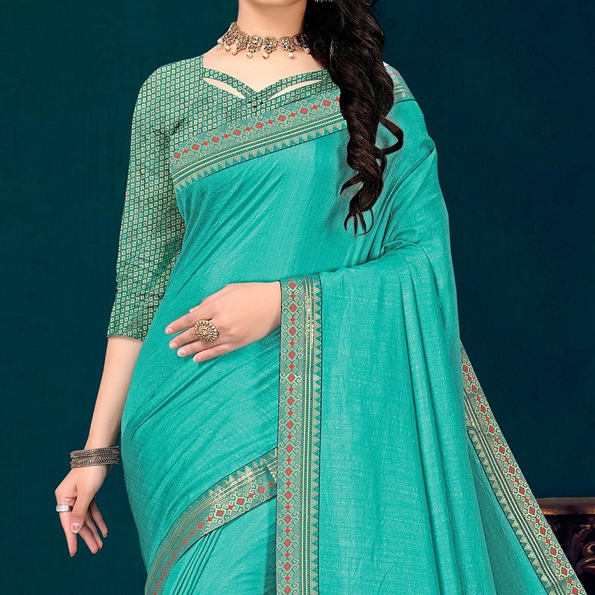 Turquoise Embellished Vichitra Silk Saree - Peachmode