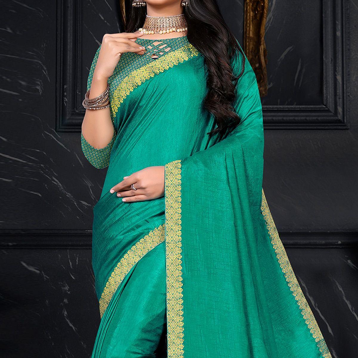 Turquoise Festive Wear Embellished Vichitra Silk Saree - Peachmode