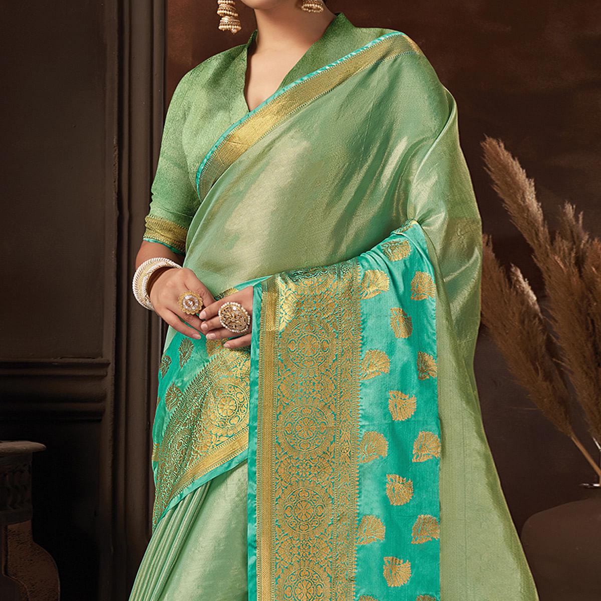 Turquoise Festive Wear Solid Organza Saree With Tassels - Peachmode