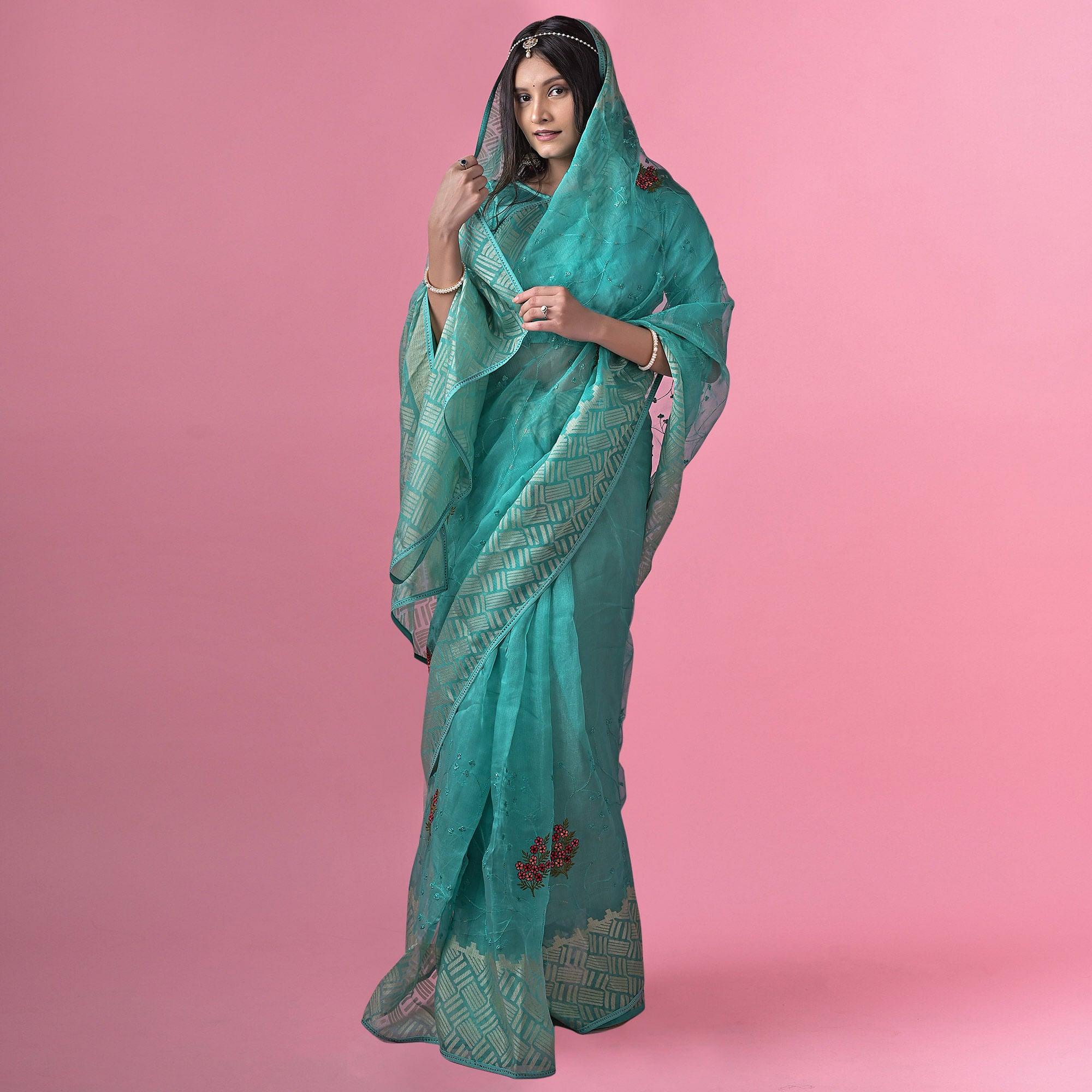 Turquoise Floral Embroidered Brasso Saree - Peachmode