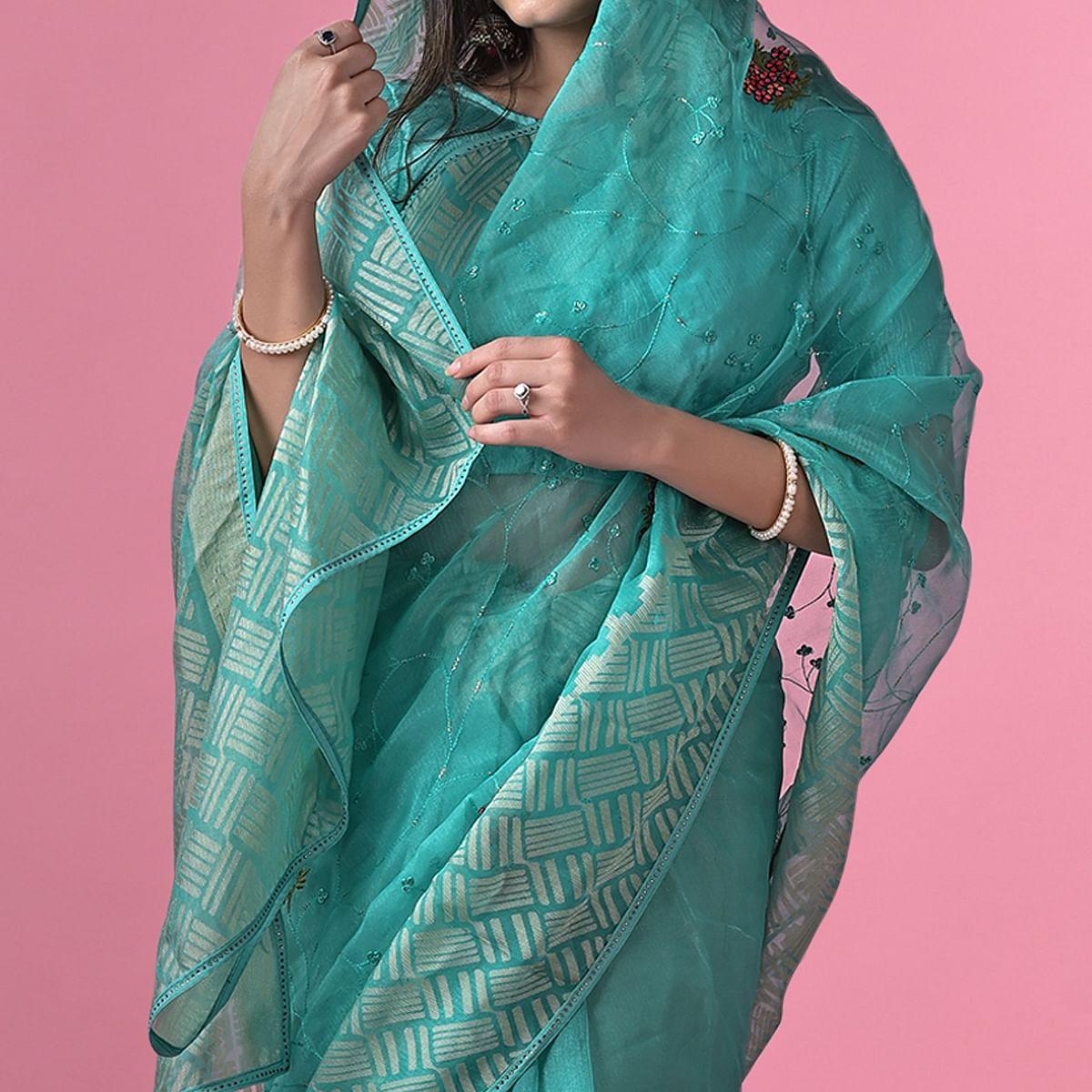 Turquoise Floral Embroidered Brasso Saree - Peachmode
