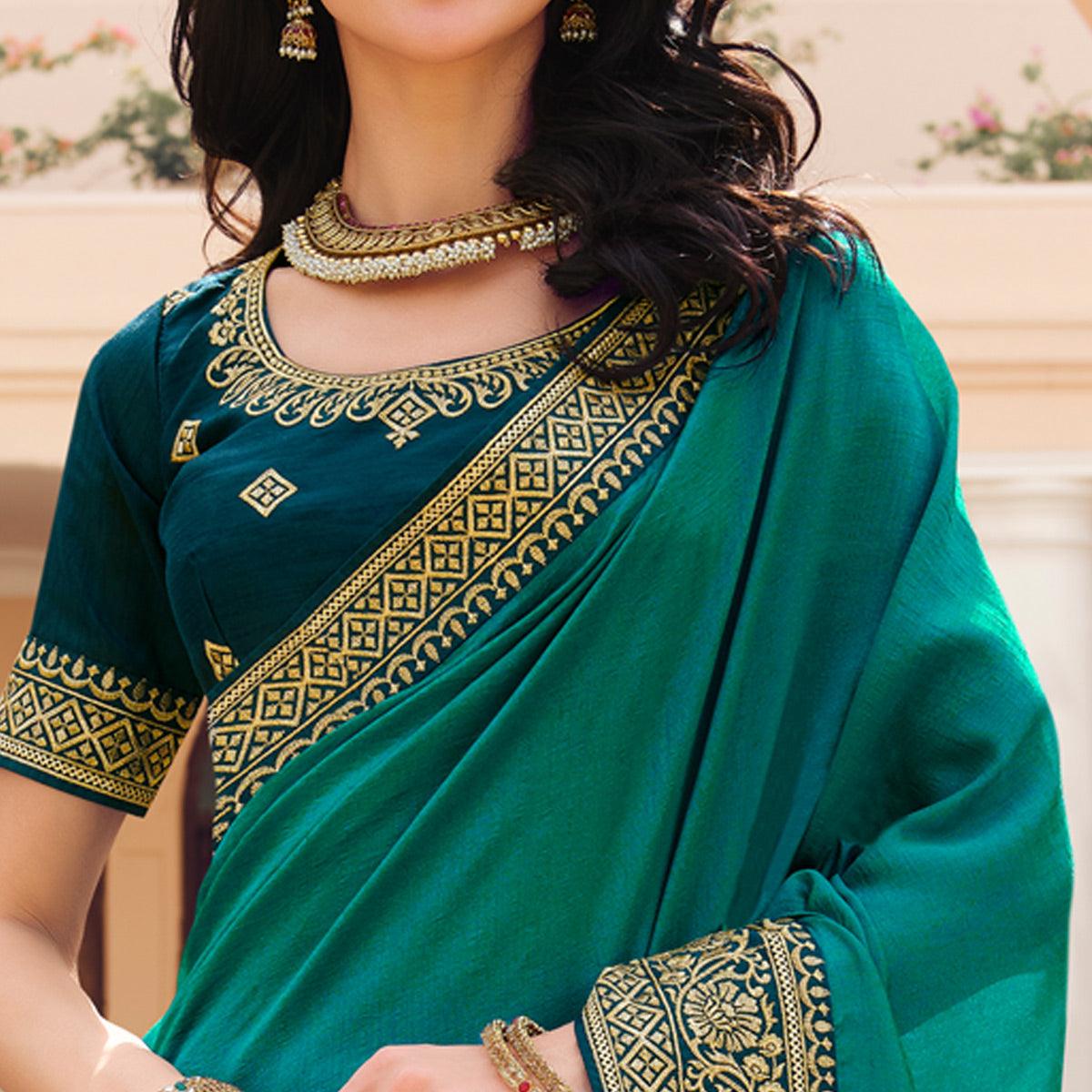 Turquoise Solid Vichitra Silk Saree With Tassels - Peachmode
