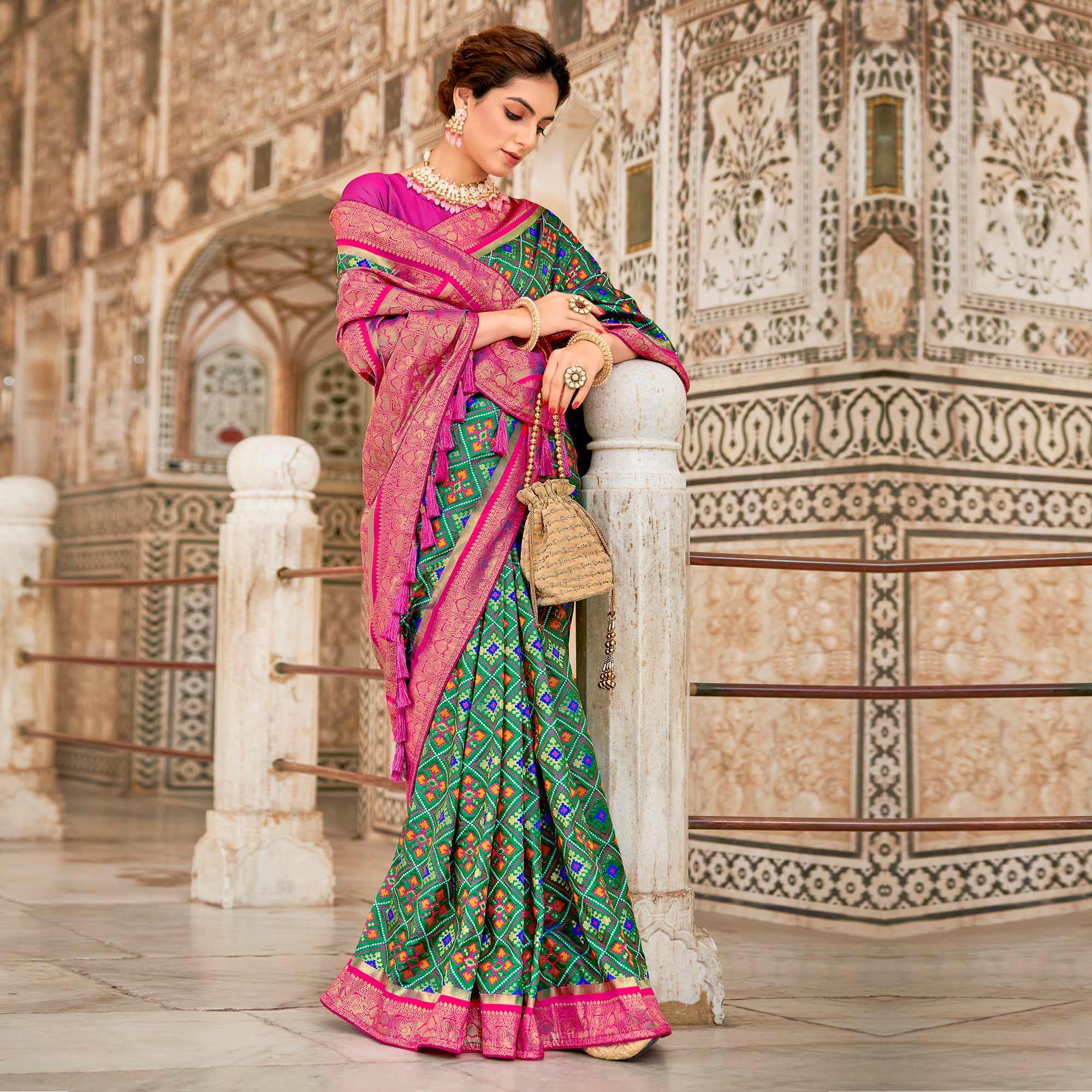 Turquoise Woven Art Silk Patola Saree With Tassels - Peachmode