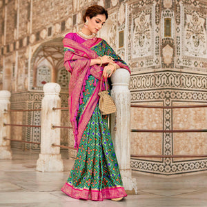 Turquoise Woven Art Silk Patola Saree With Tassels - Peachmode