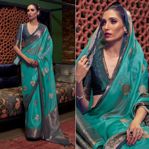 Turquoise Woven Organza Saree With Tassels - Peachmode