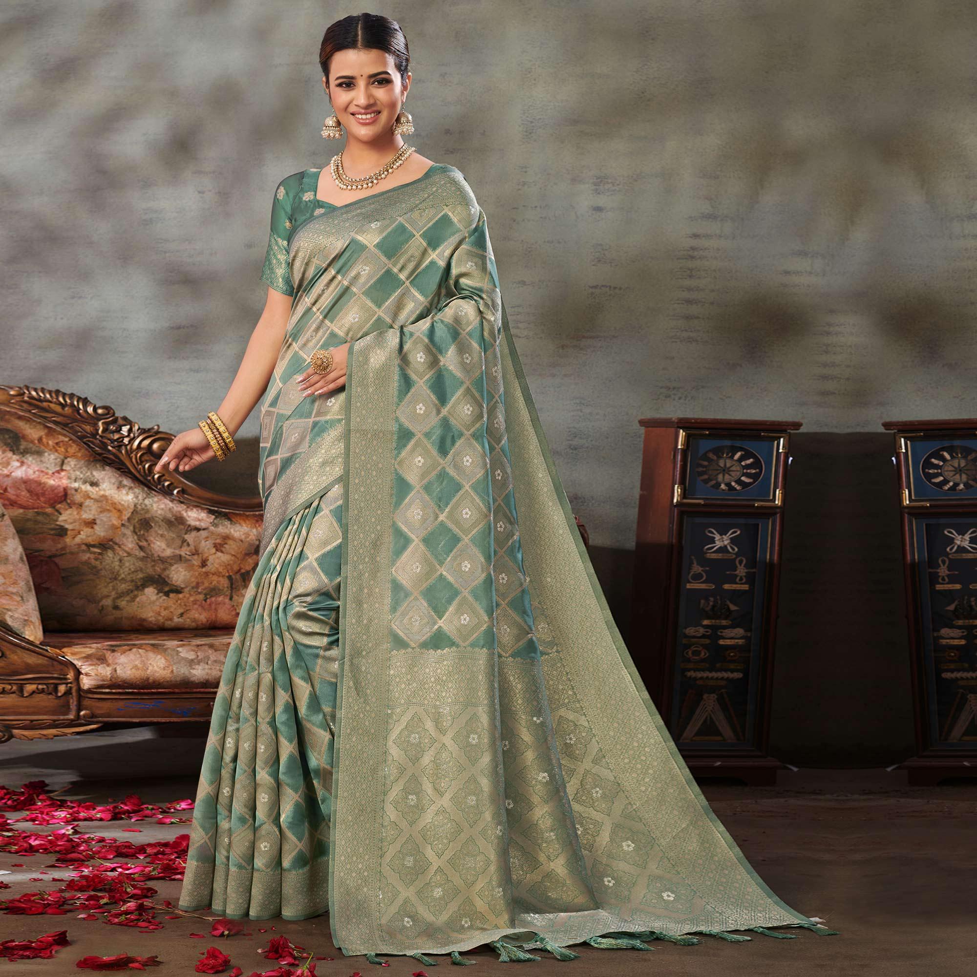 Turquoise Woven Organza Saree With Tassels - Peachmode