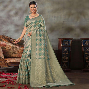Turquoise Woven Organza Saree With Tassels - Peachmode