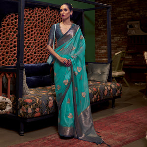Turquoise Woven Organza Saree With Tassels - Peachmode