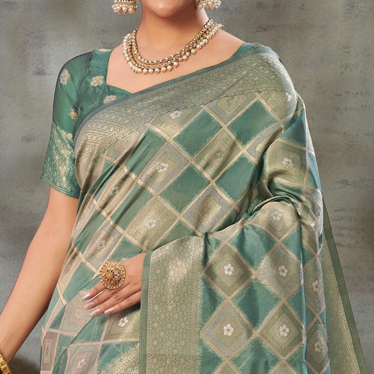 Turquoise Woven Organza Saree With Tassels - Peachmode