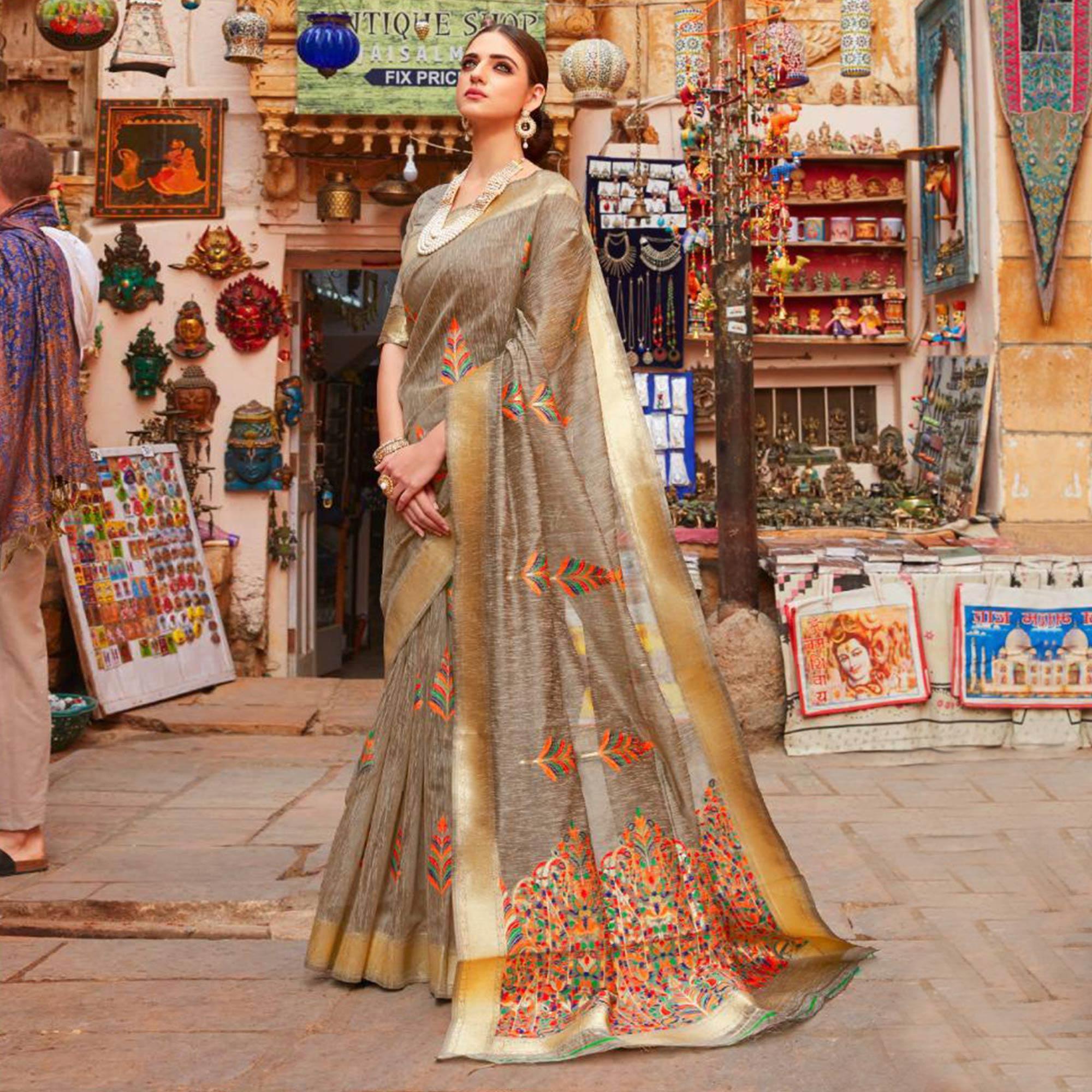 Unique Beige Colored Partywear Printed Linen Saree - Peachmode
