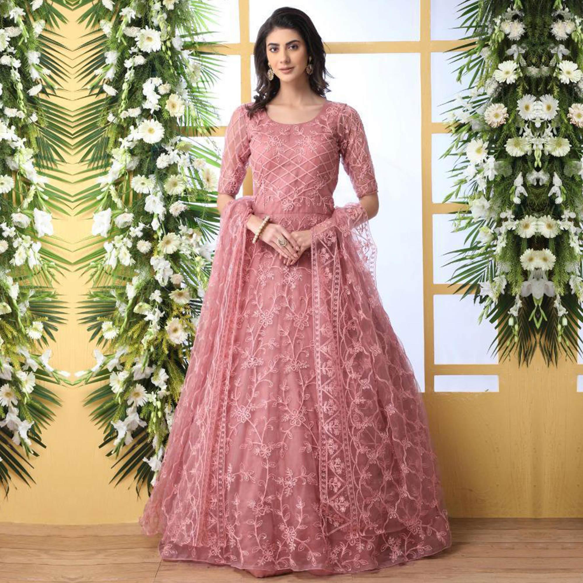 Unique Dusty Peach Colored Party Wear Embroidered Net Gown With Dupatt Unique Dusty Peach Colored Party Wear Embroidered Net Gown With Dupatt