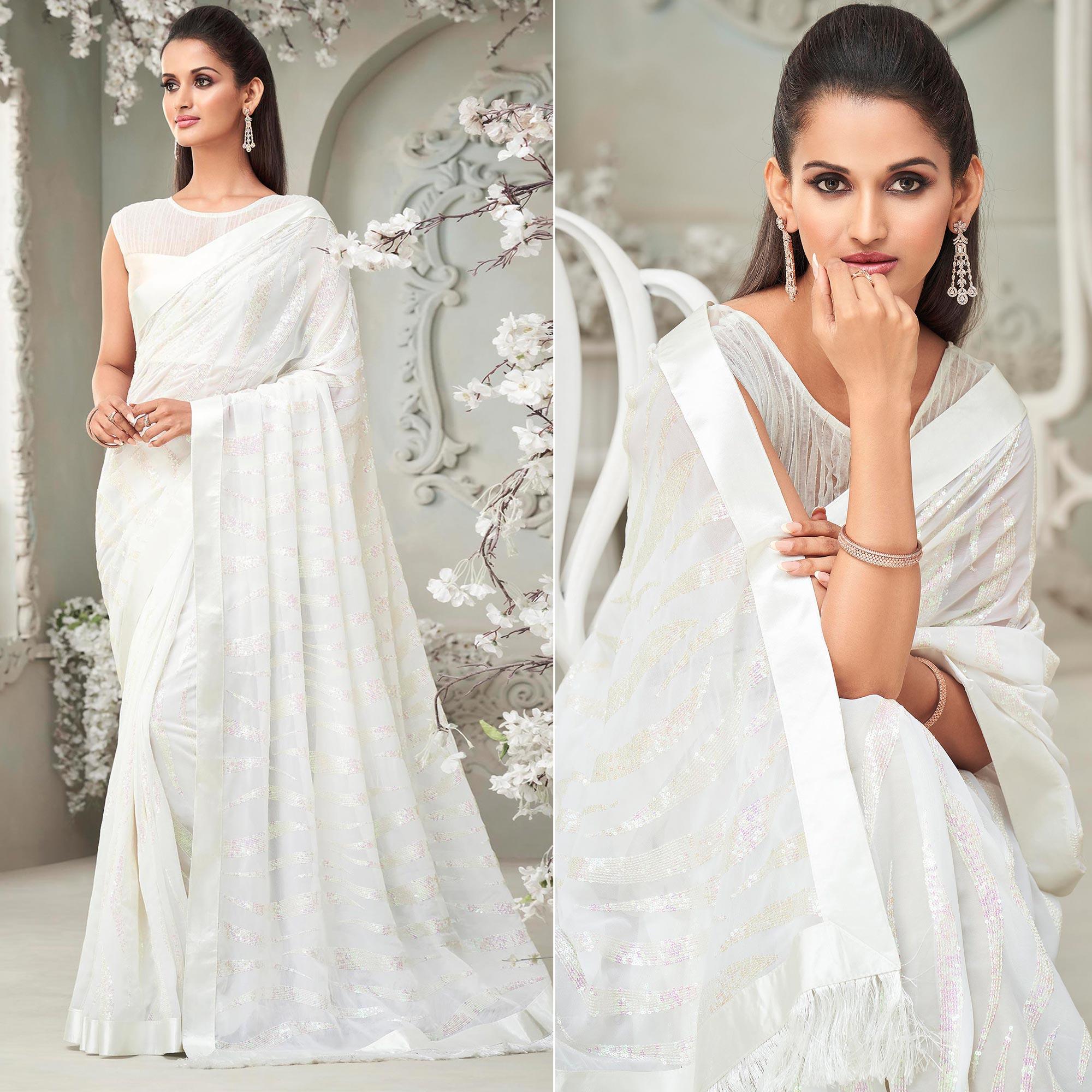 White Sequence Embroidered Georgette Saree With Tassels - Peachmode