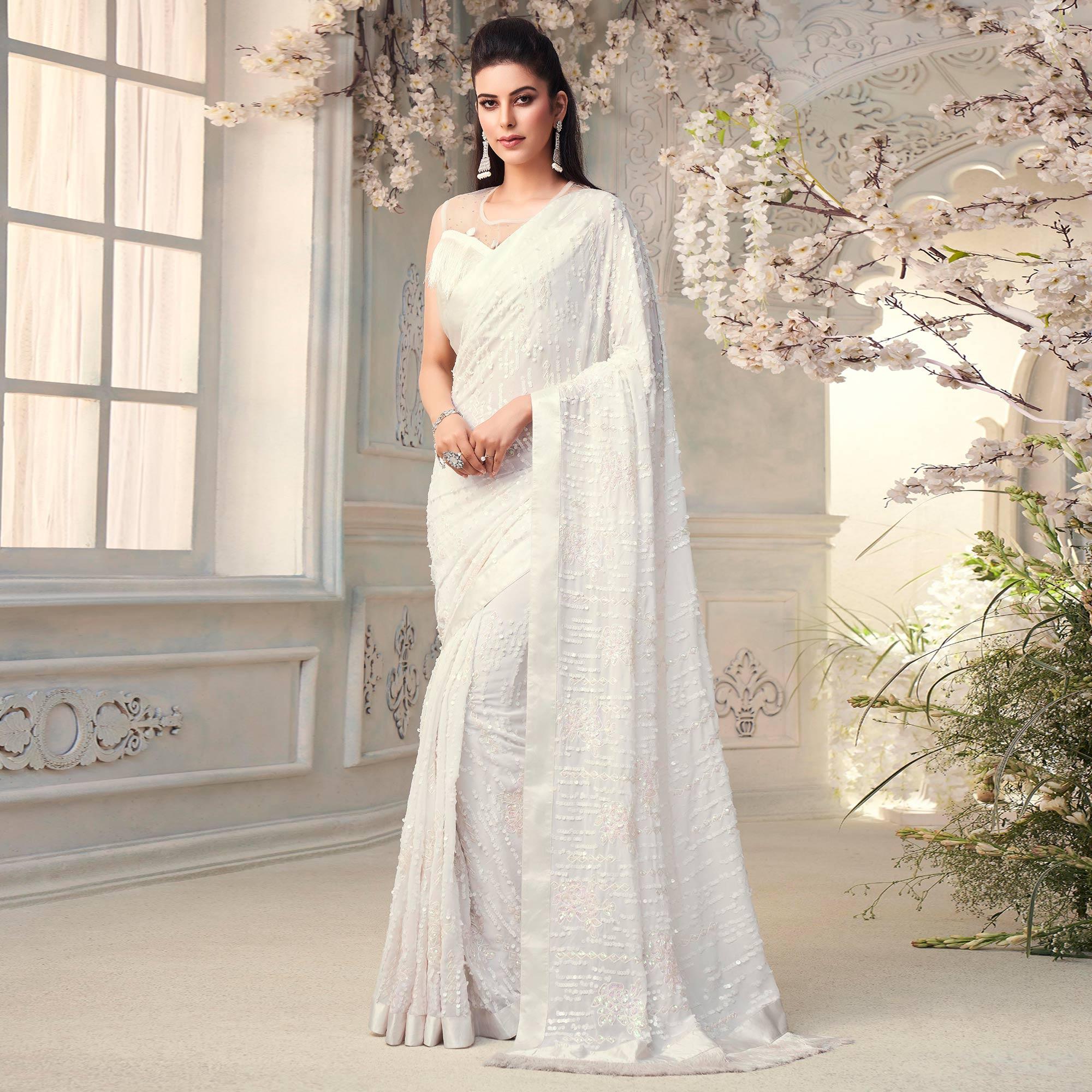 White Sequence Embroidered Georgette Saree With Tassels - Peachmode