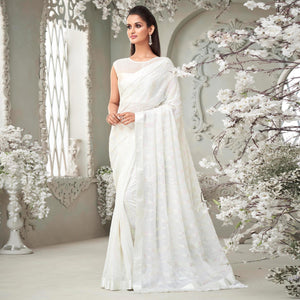 White Sequence Embroidered Georgette Saree With Tassels - Peachmode