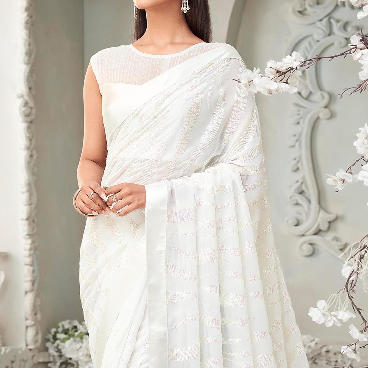 White Sequence Embroidered Georgette Saree With Tassels - Peachmode