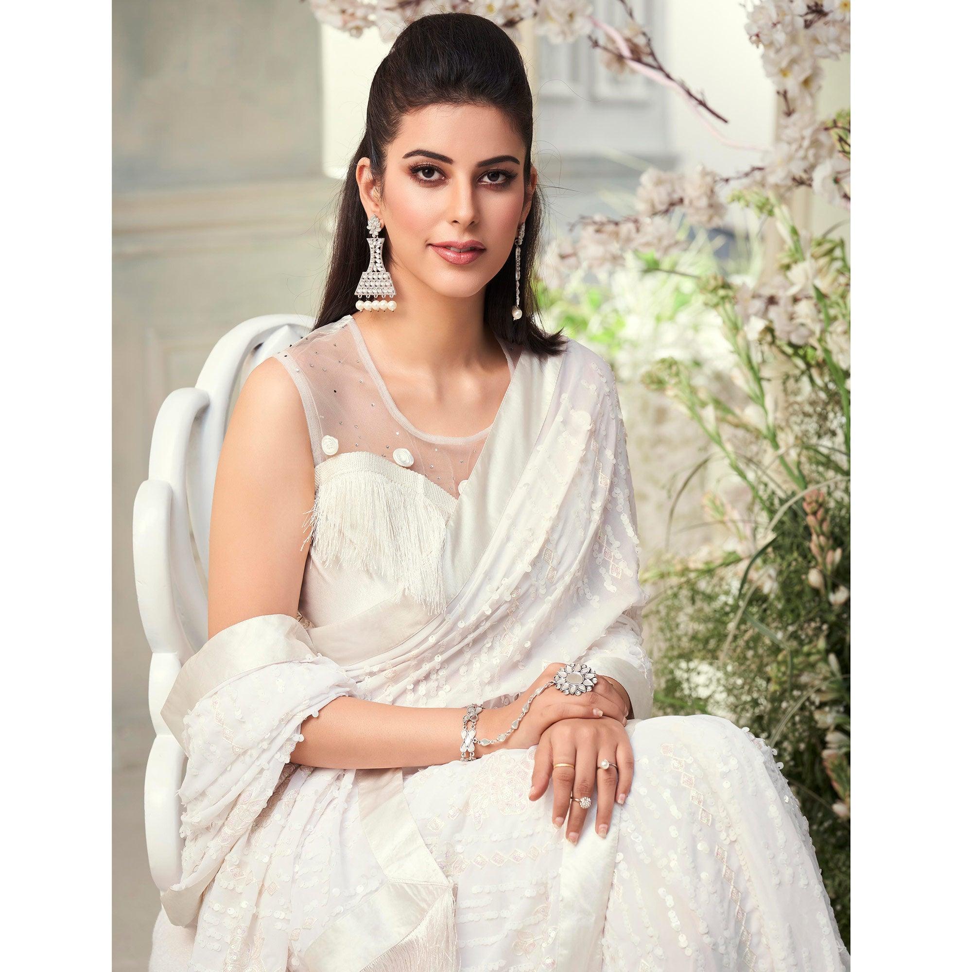 White Sequence Embroidered Georgette Saree With Tassels - Peachmode