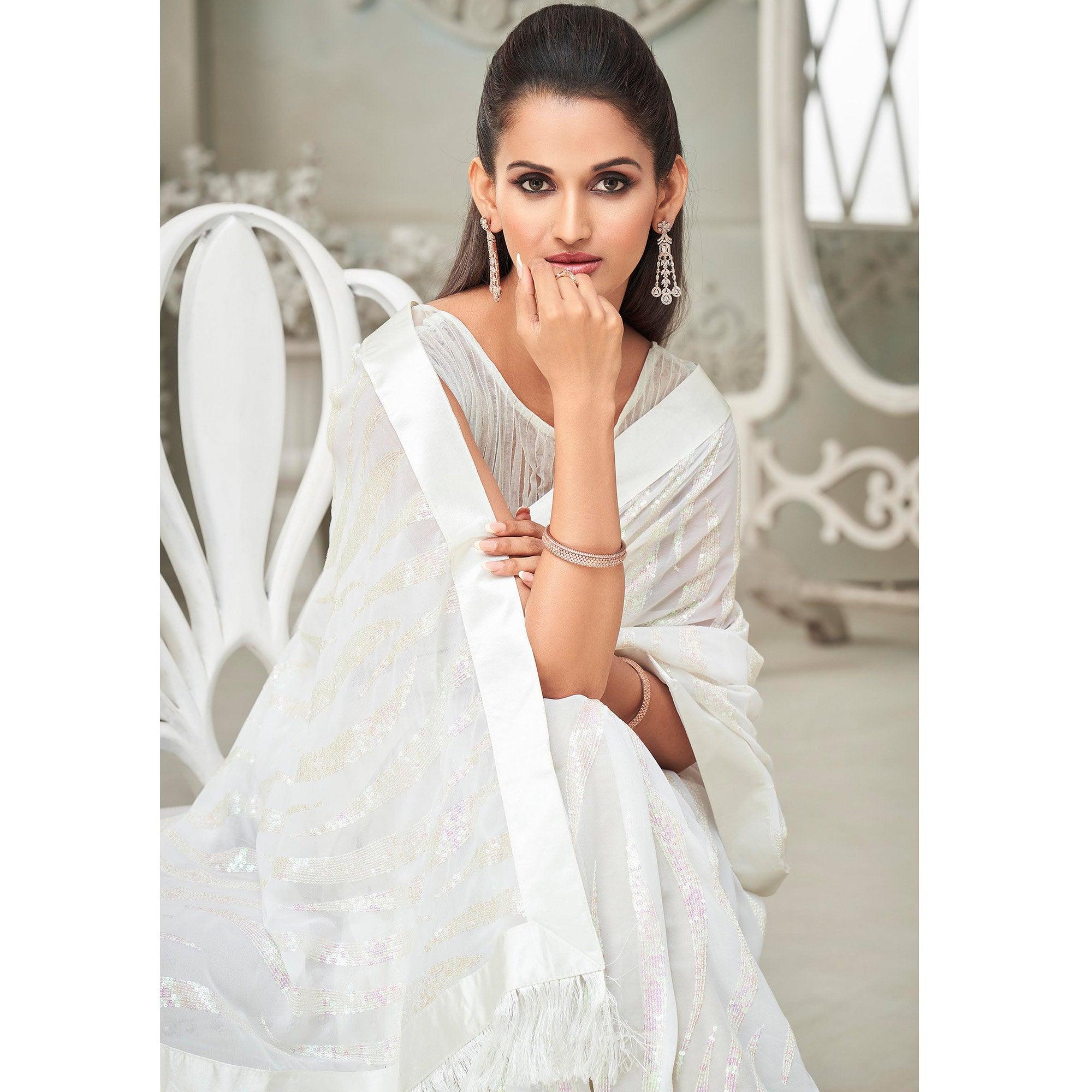 White Sequence Embroidered Georgette Saree With Tassels - Peachmode