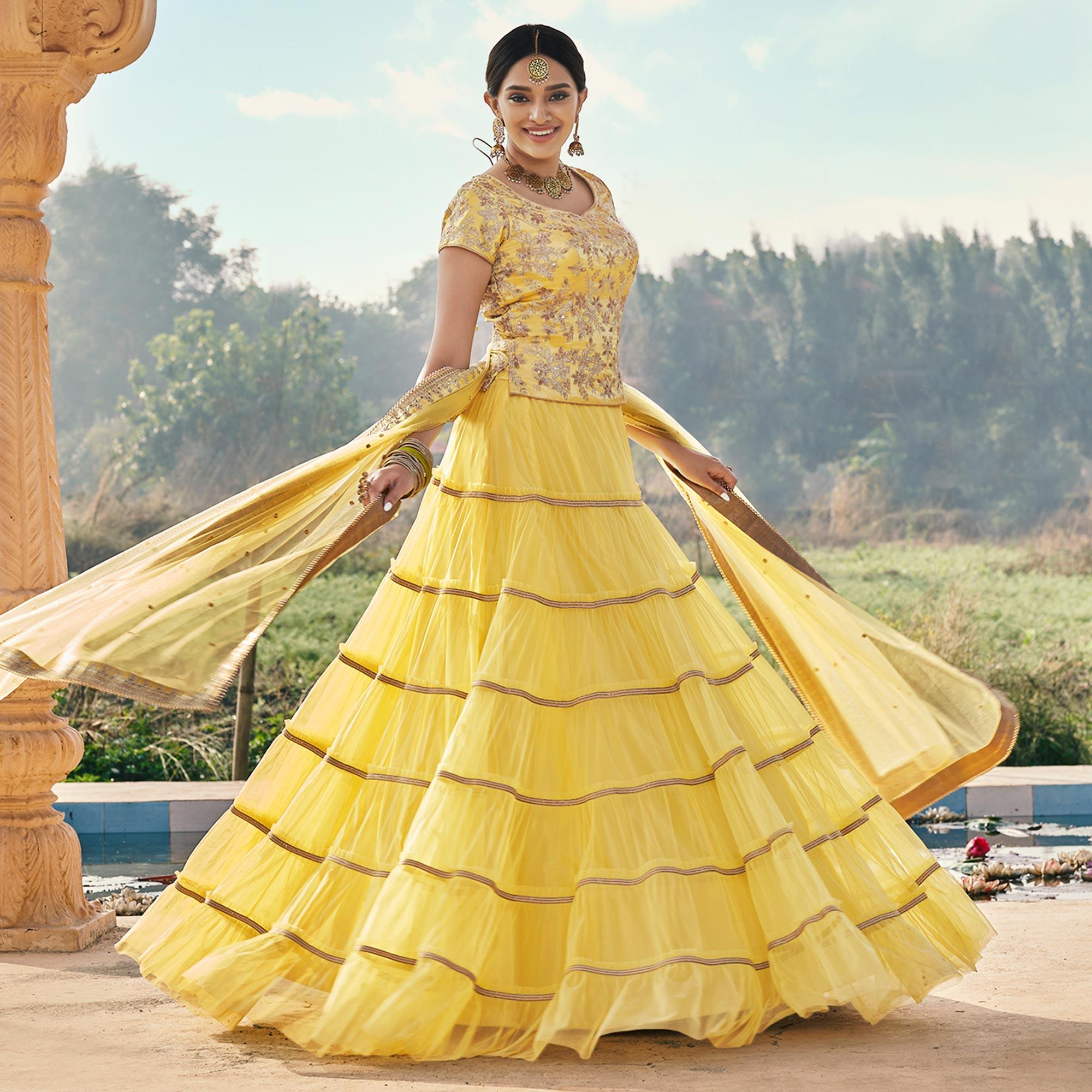 Yellow Partywear Floral Embroidered Soft Net Panelled Lehenga Choli - Peachmode