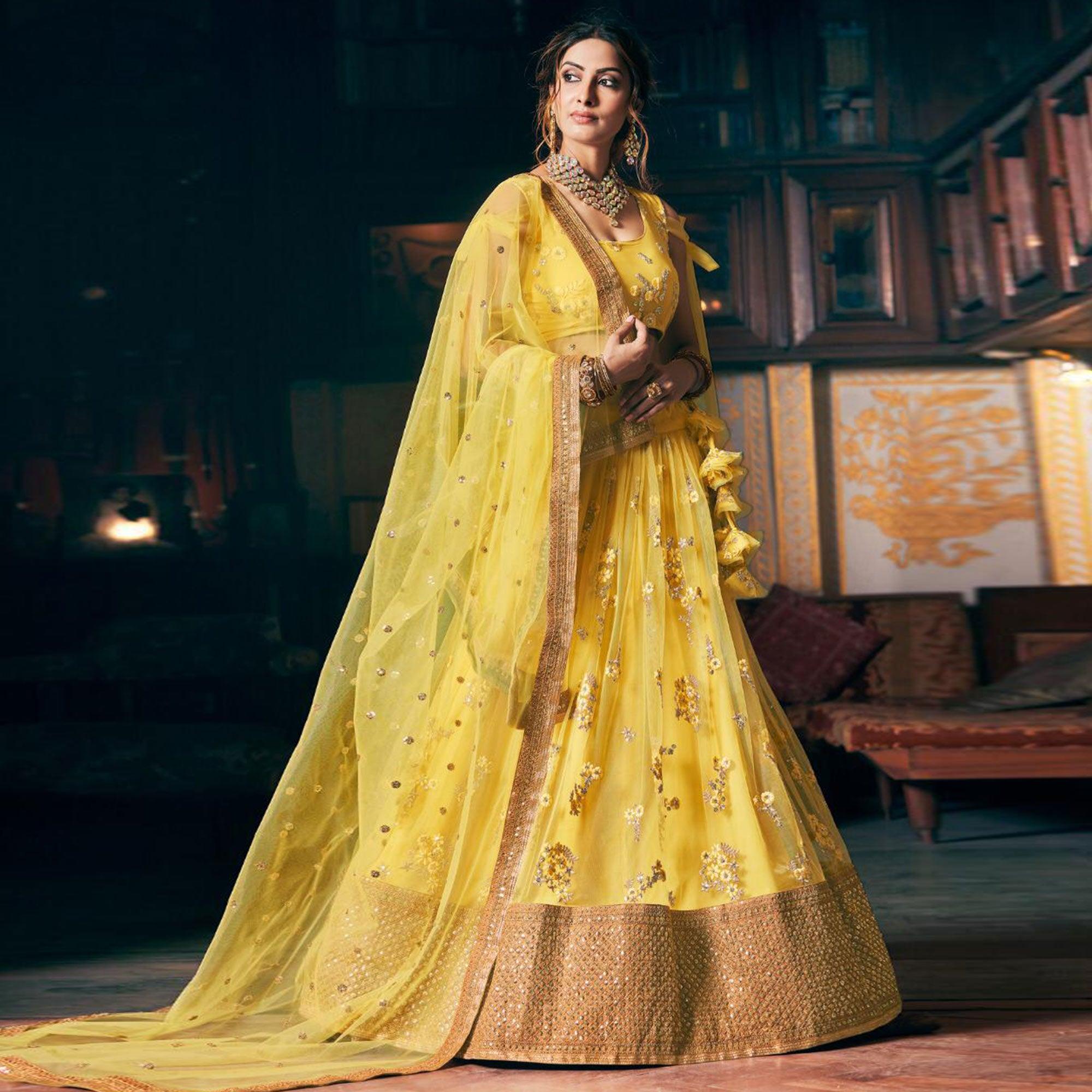 Yellow Wedding Wear Floral Embroidery With Sequence And Dori Work Net Lehenga Choli - Peachmode