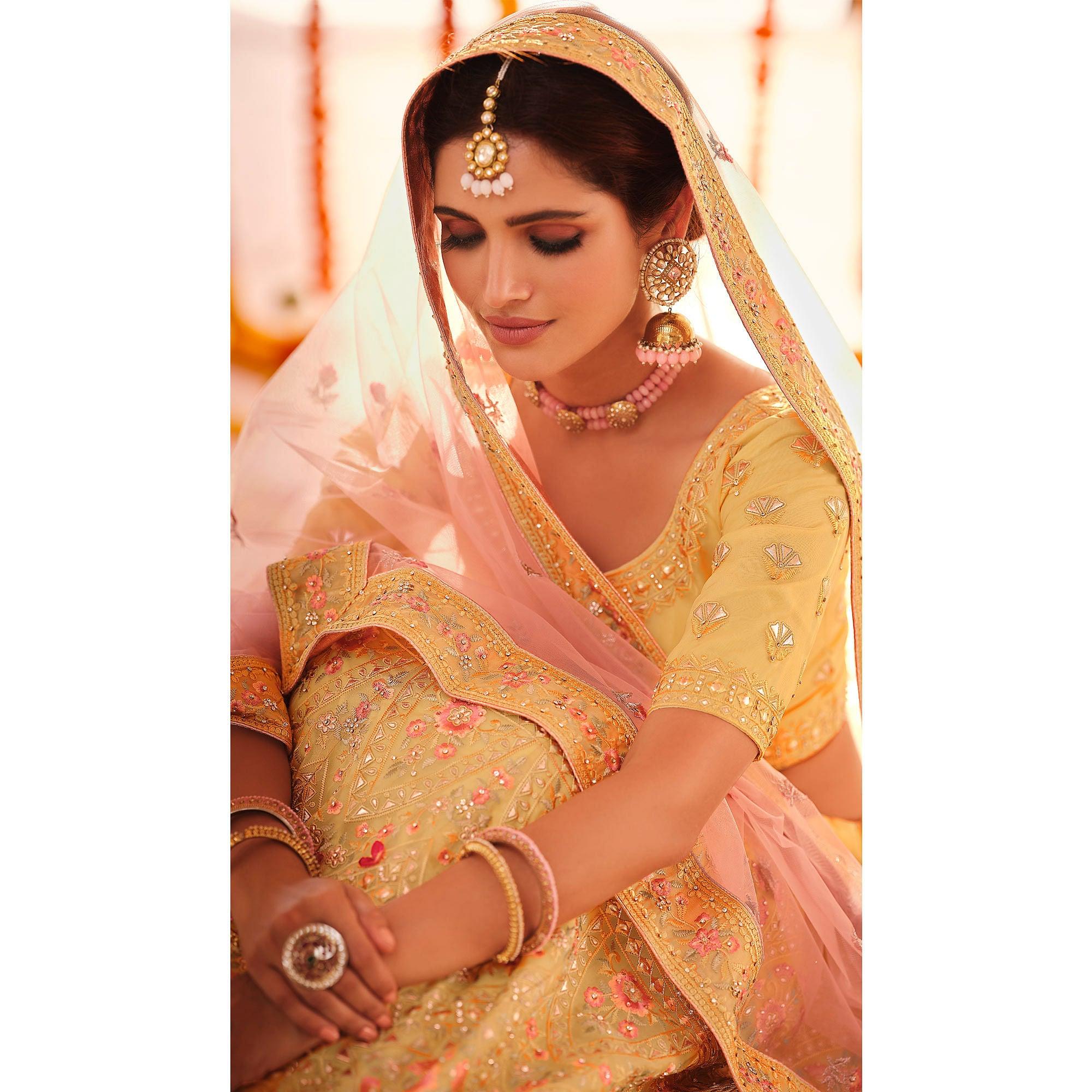 Yellow Wedding Wear Heavy Embroidered Organza Lehenga Choli - Peachmode