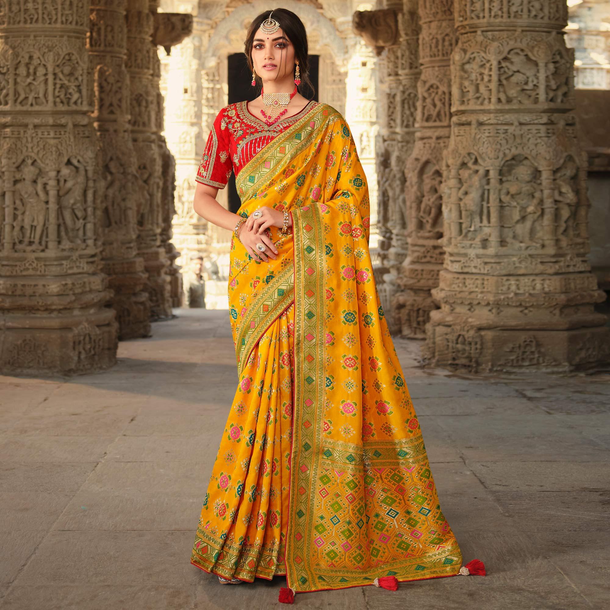 Yellow Wedding Wear Woven Silk Saree With Tassels - Peachmode