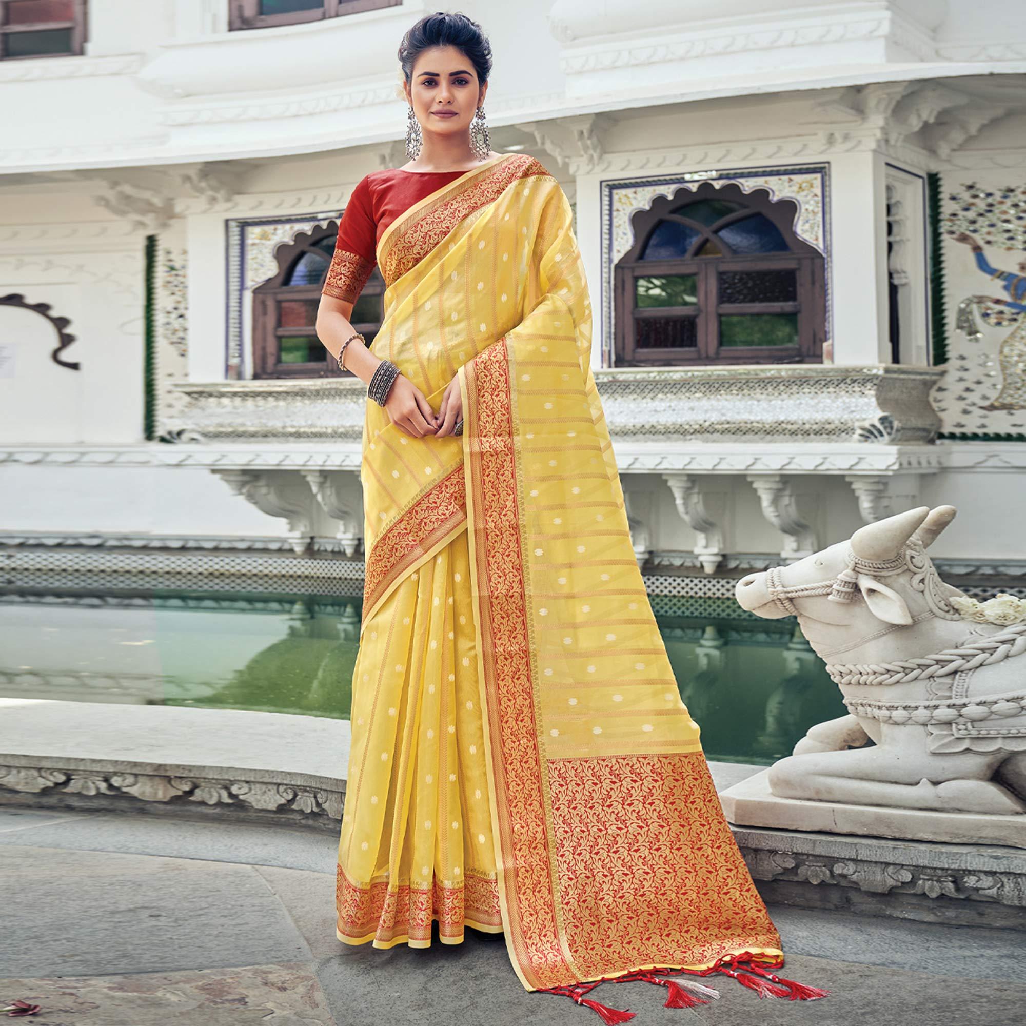 Yellow Woven Organza Saree With Tassels - Peachmode